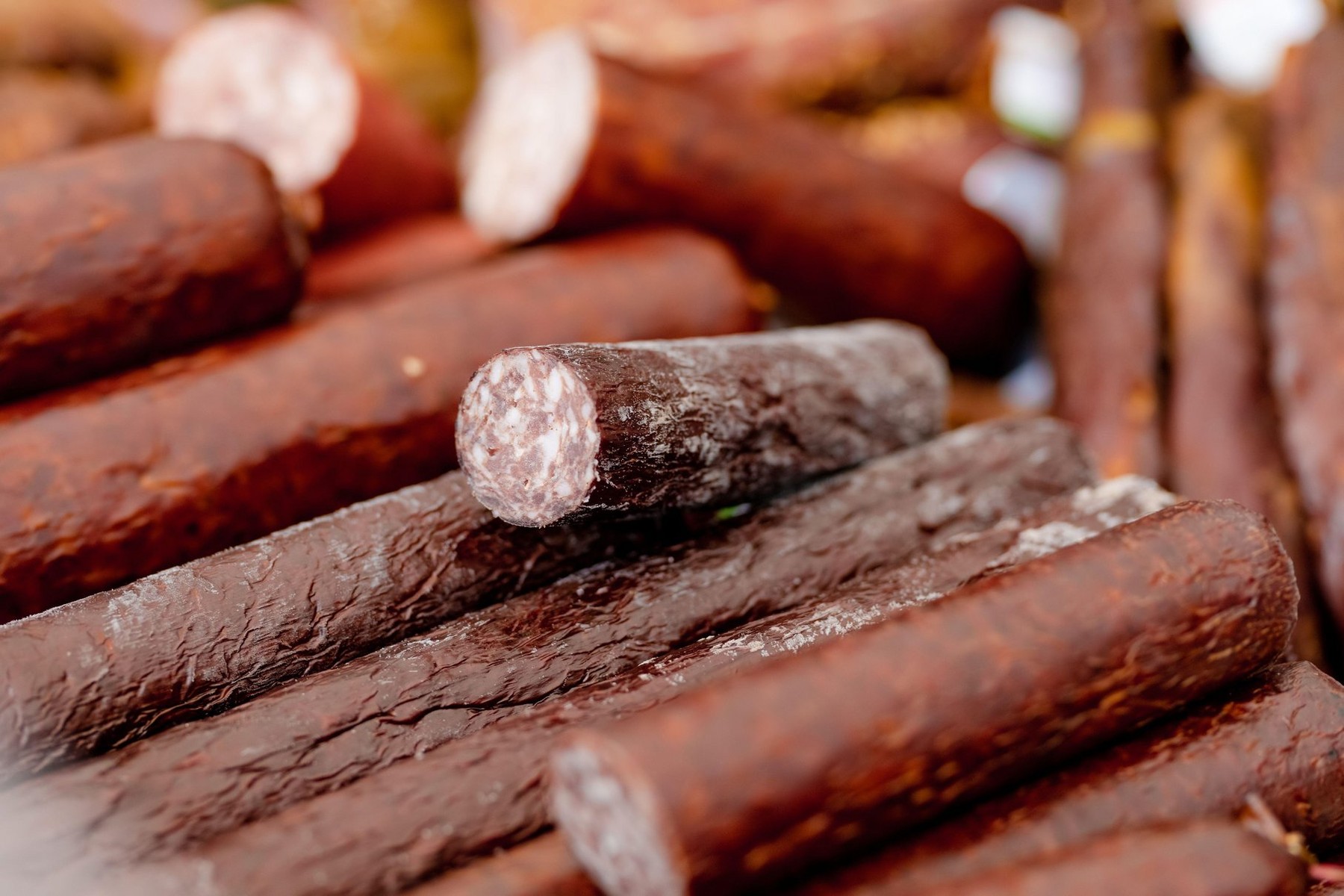 Selection of assorted home made meats, jerky and sausages on a farmers market in Vilnius, Lithuania. Kaziukas, traditional spring fair in capital of L