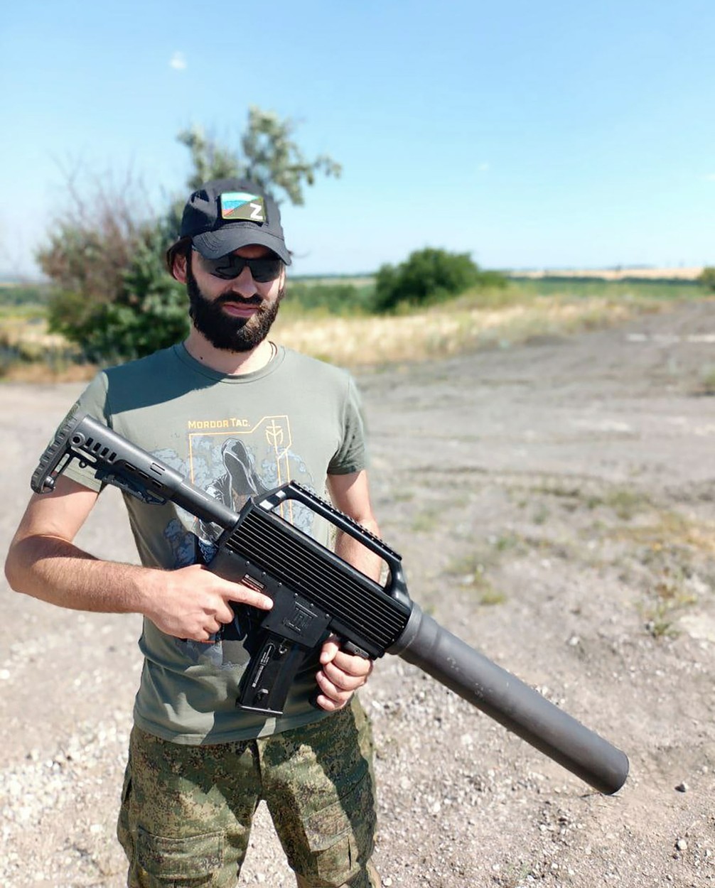 Russian ultranationalist fighter Igor Mangushev is seen on stage with a skull allegedly belonging to a killed Ukrainian Azov soldier.