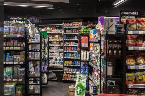BELGRADE, SERBIA - MAY 3, 2020: Shelves of a Supermarket aisle in the city center of Belgrade with various food and consumer goods packed, ready for b