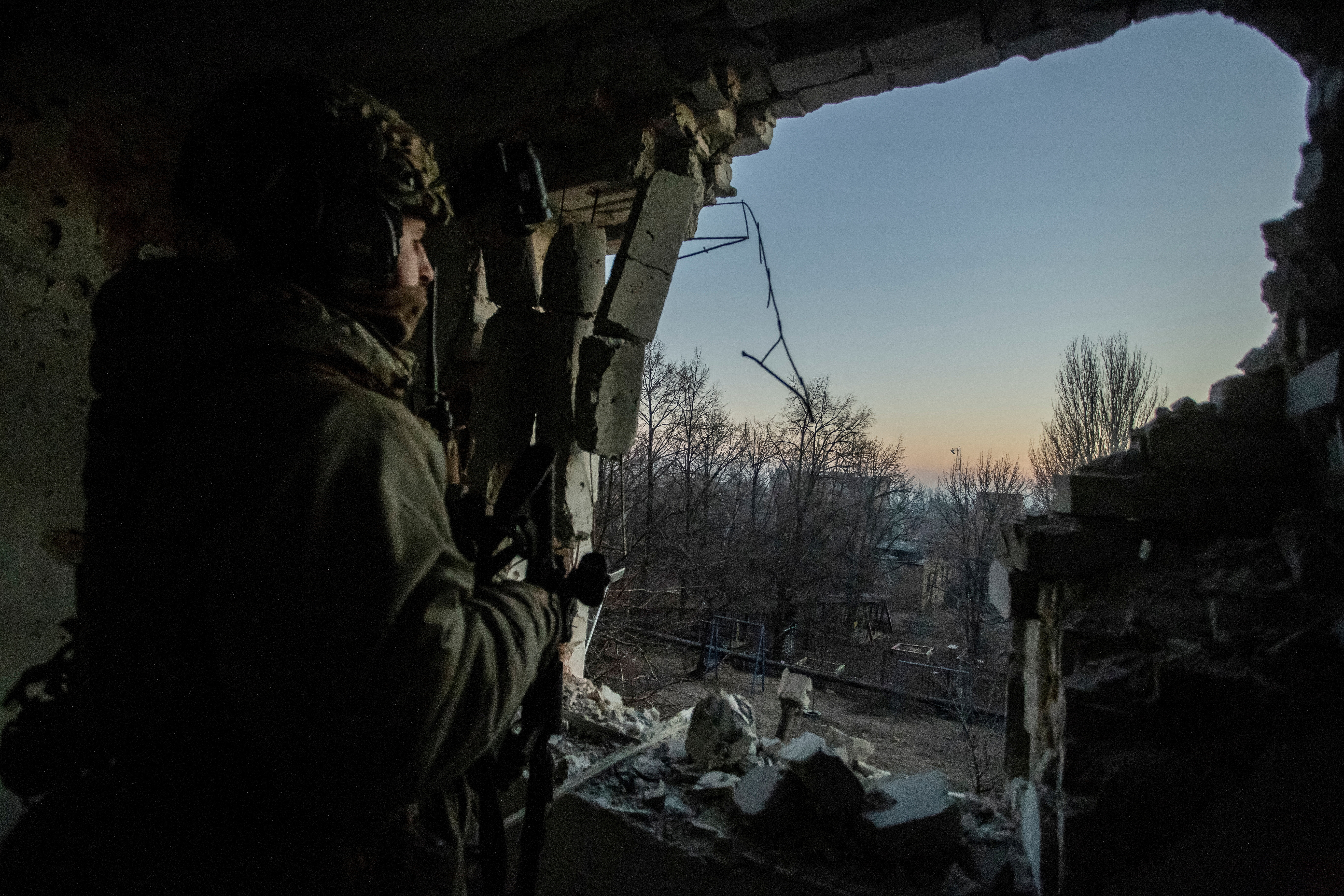 FILE PHOTO: A Ukrainian serviceman looks on in Bakhmut