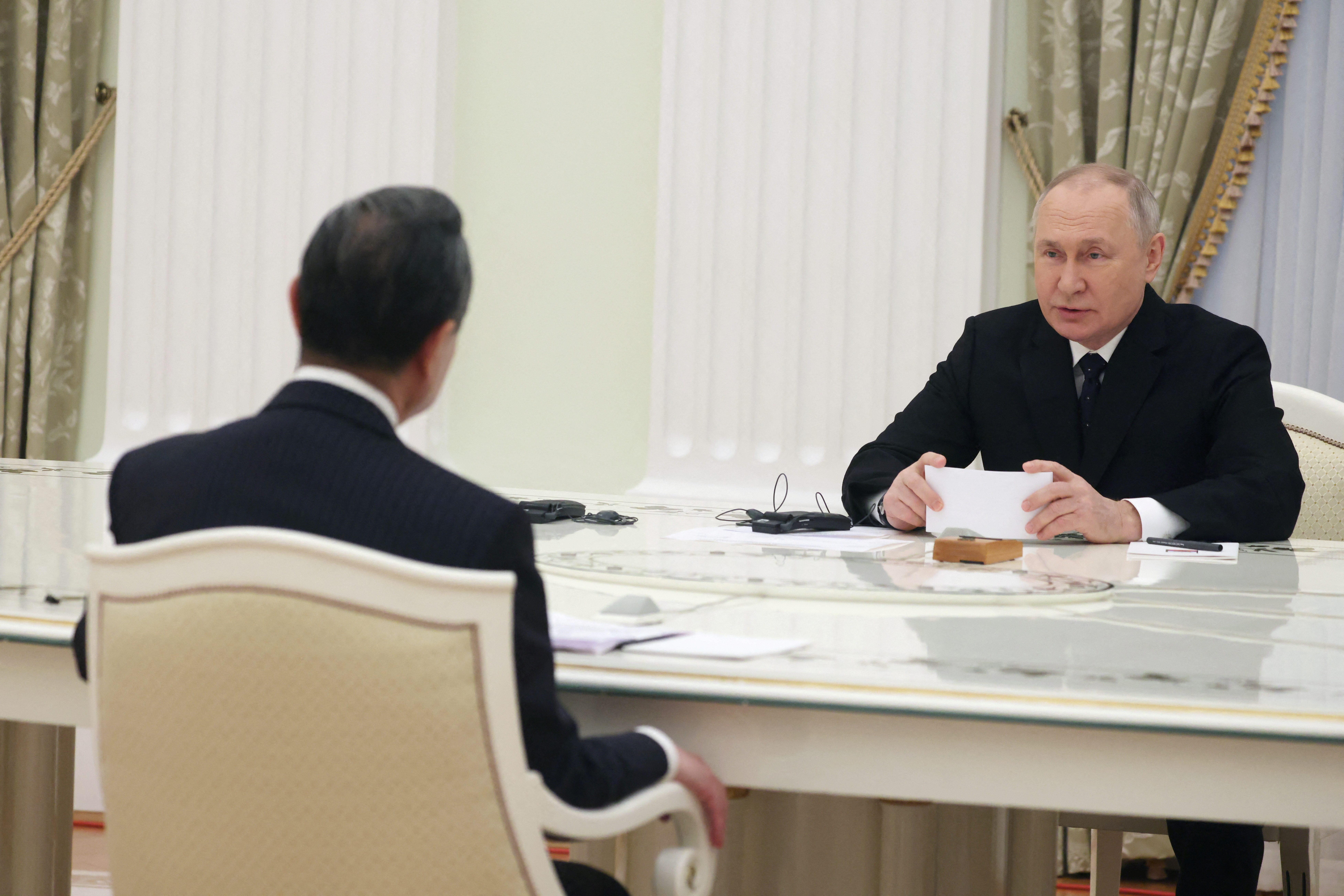 Russia's President Vladimir Putin meets with China's top diplomat Wang Yi in Moscow