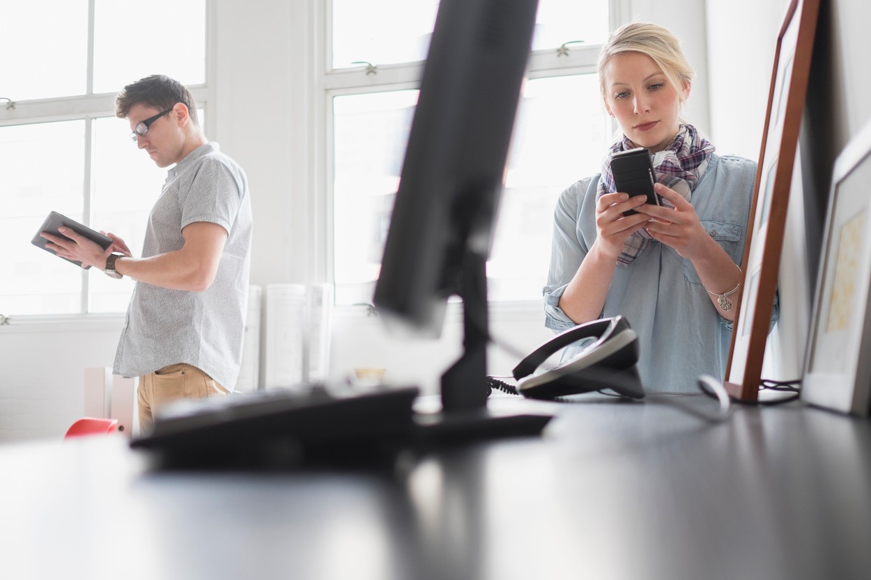 Man and woman working in office