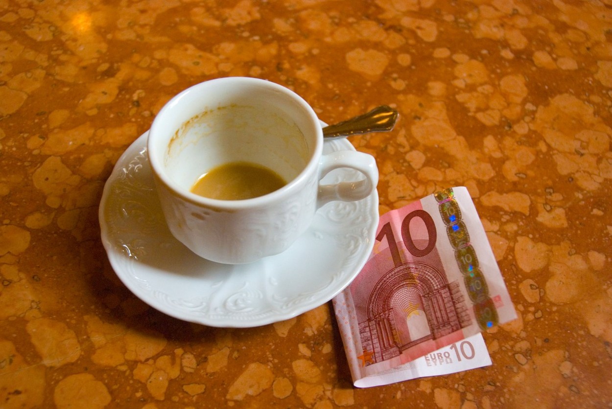 Empty coffee cup and a ten euro note in Cafe Central in Vienna Austria Europe