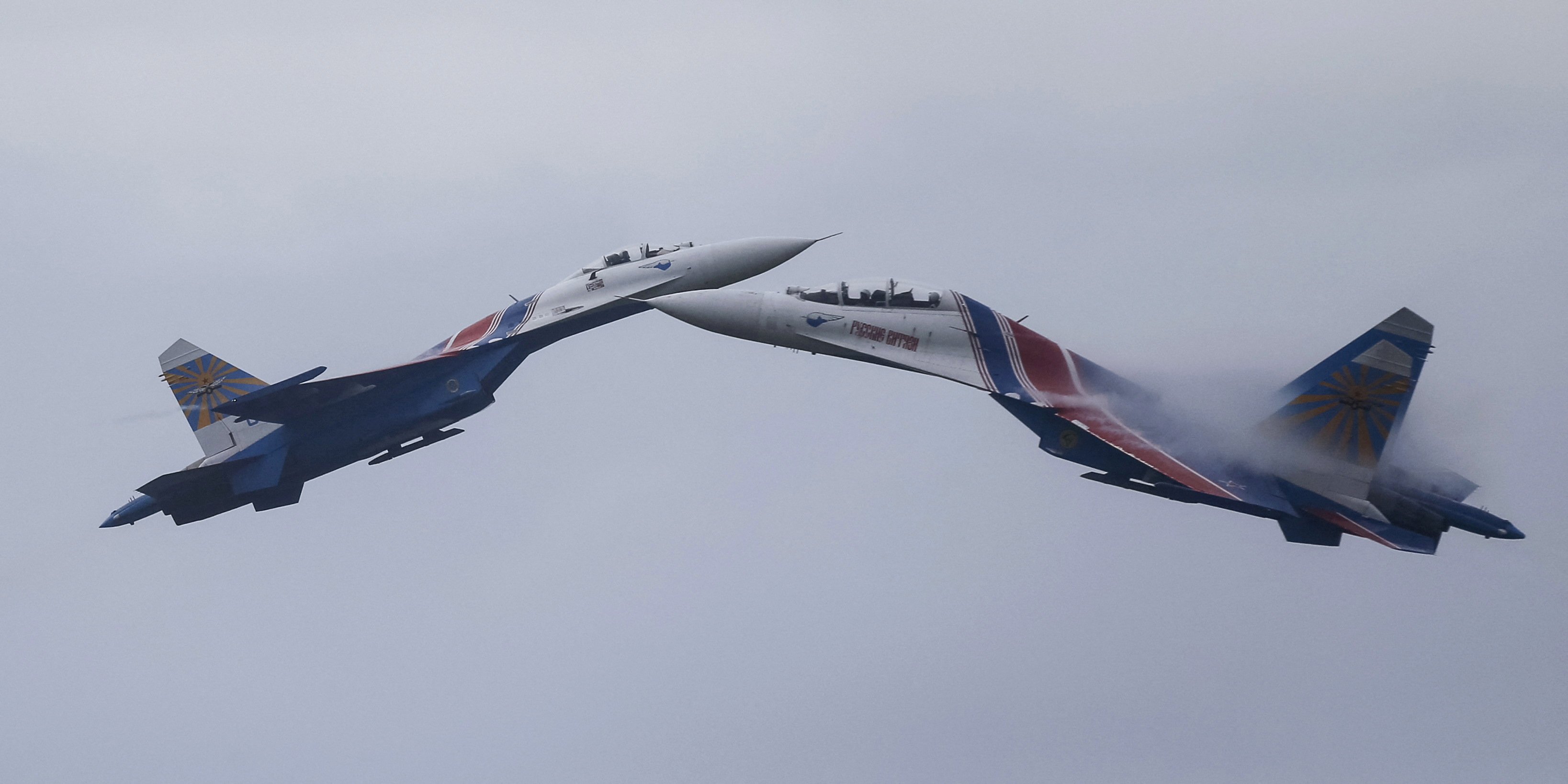 FILE PHOTO: Sukhoi Su-27 Flanker fighters of the Russkiye Vityazi aerobatic display team perform during a demonstration flight at the opening ceremony of the International Army Games in Alabino, outside Moscow, Russia