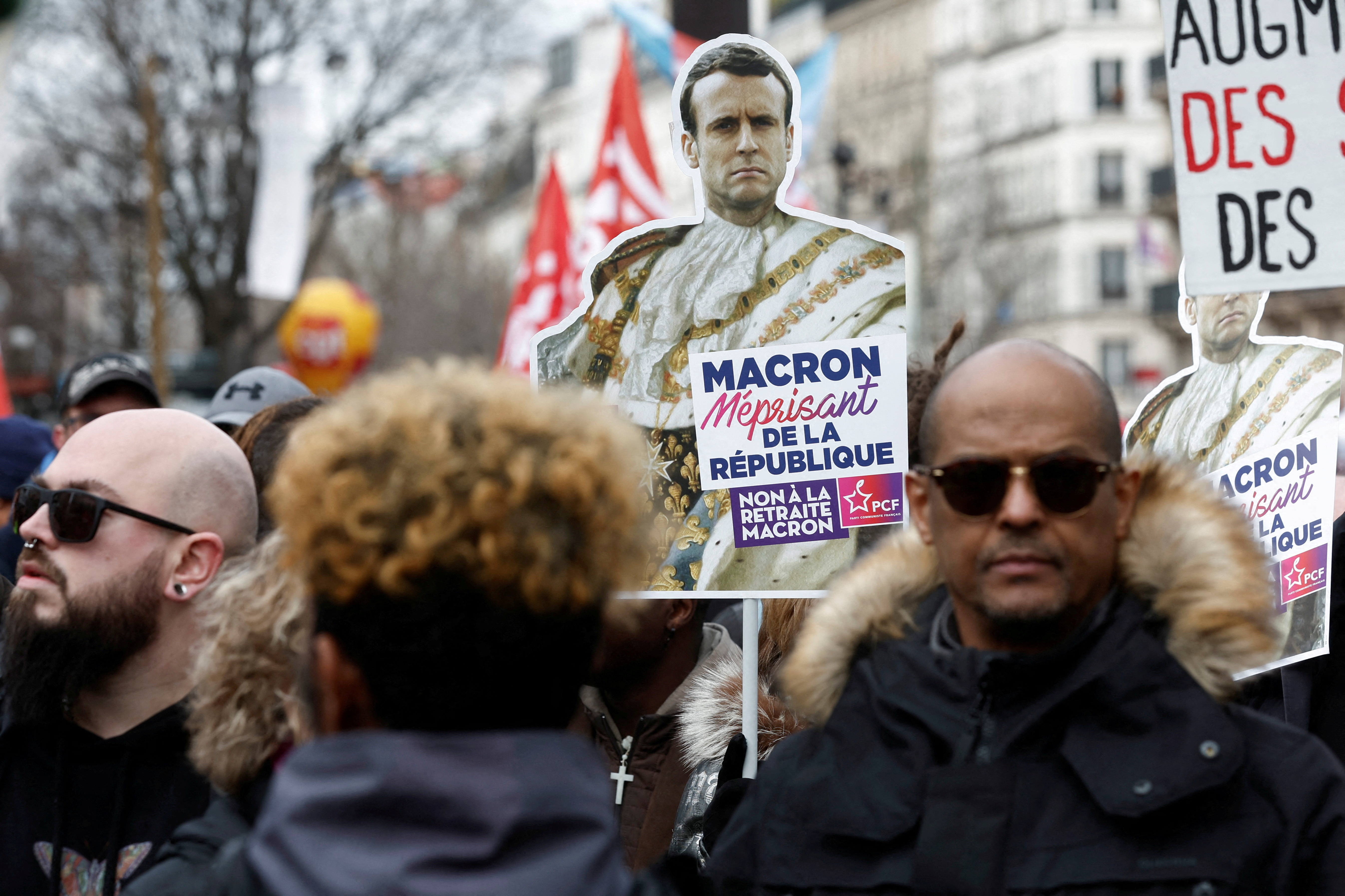 FILE PHOTO: French unions and workers march against pension reforms in Paris