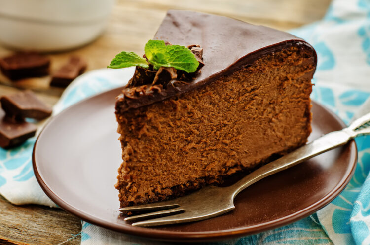 Chocolate,Cheesecake,With,Chocolate,Glaze,On,Dark,Wood,Background.,Tinting.
