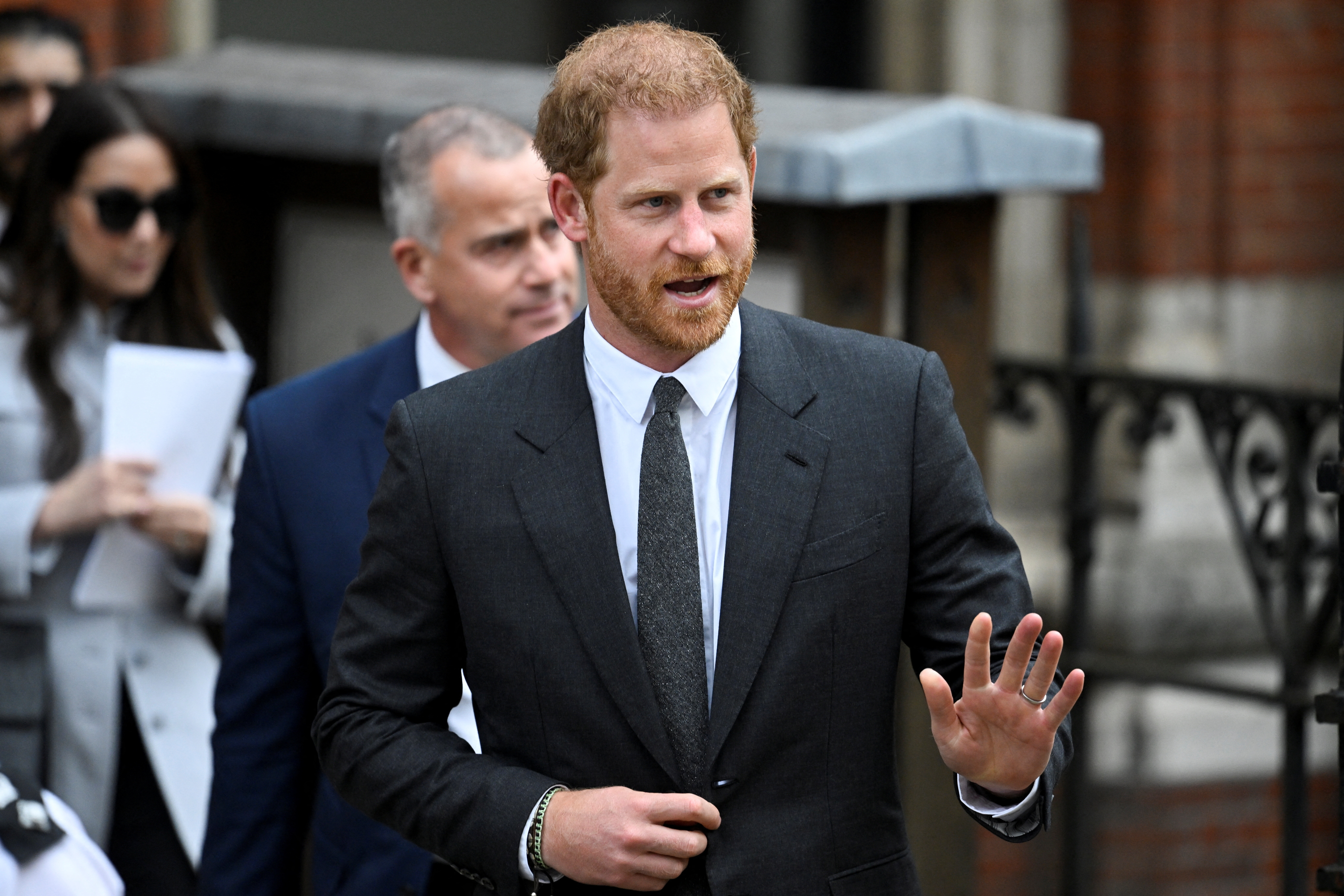 Britain's Prince Harry walks outside the High Court, in London