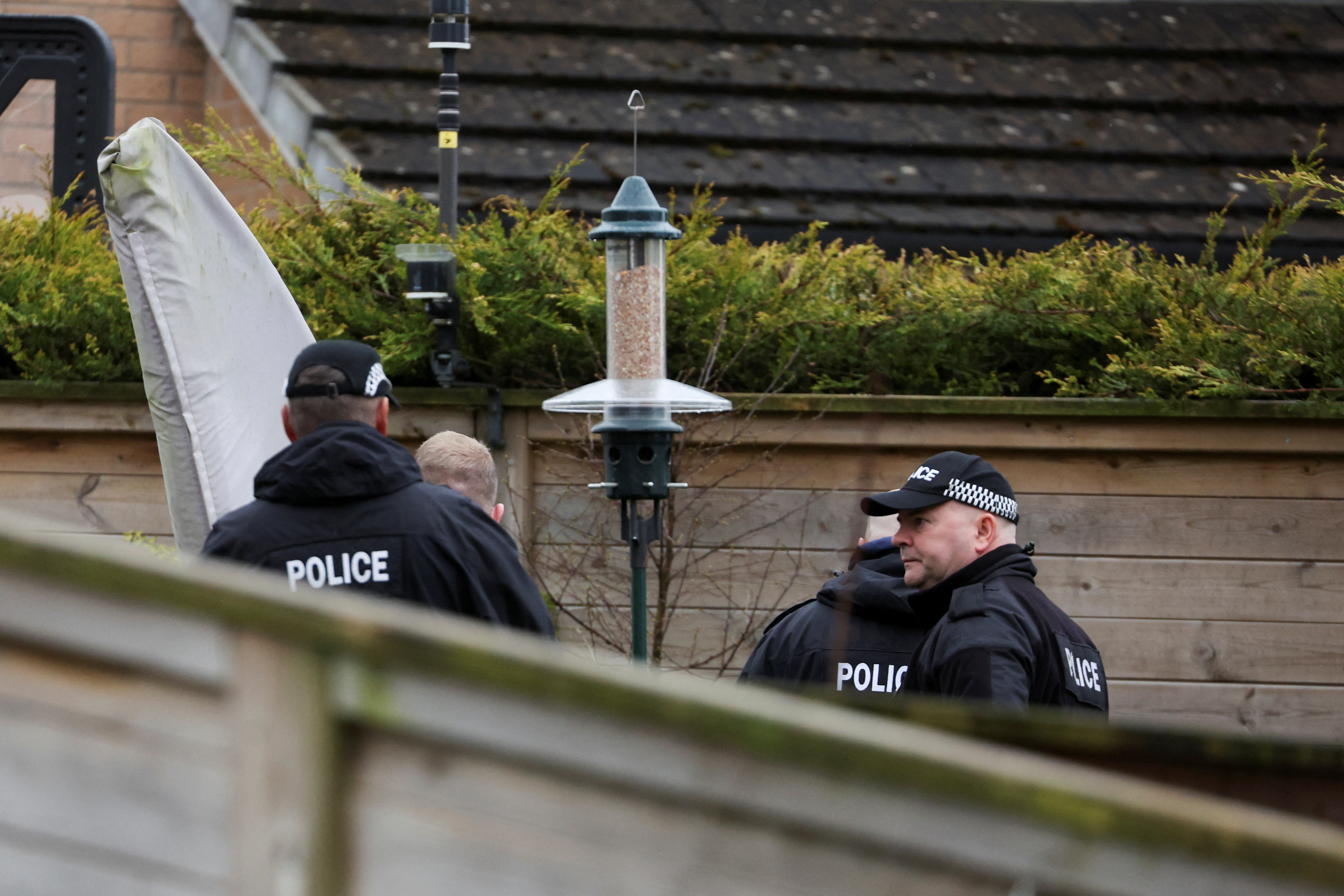 Police officers stand outside the house of former SNP Chief Executive Peter Murrell, in Glasgow