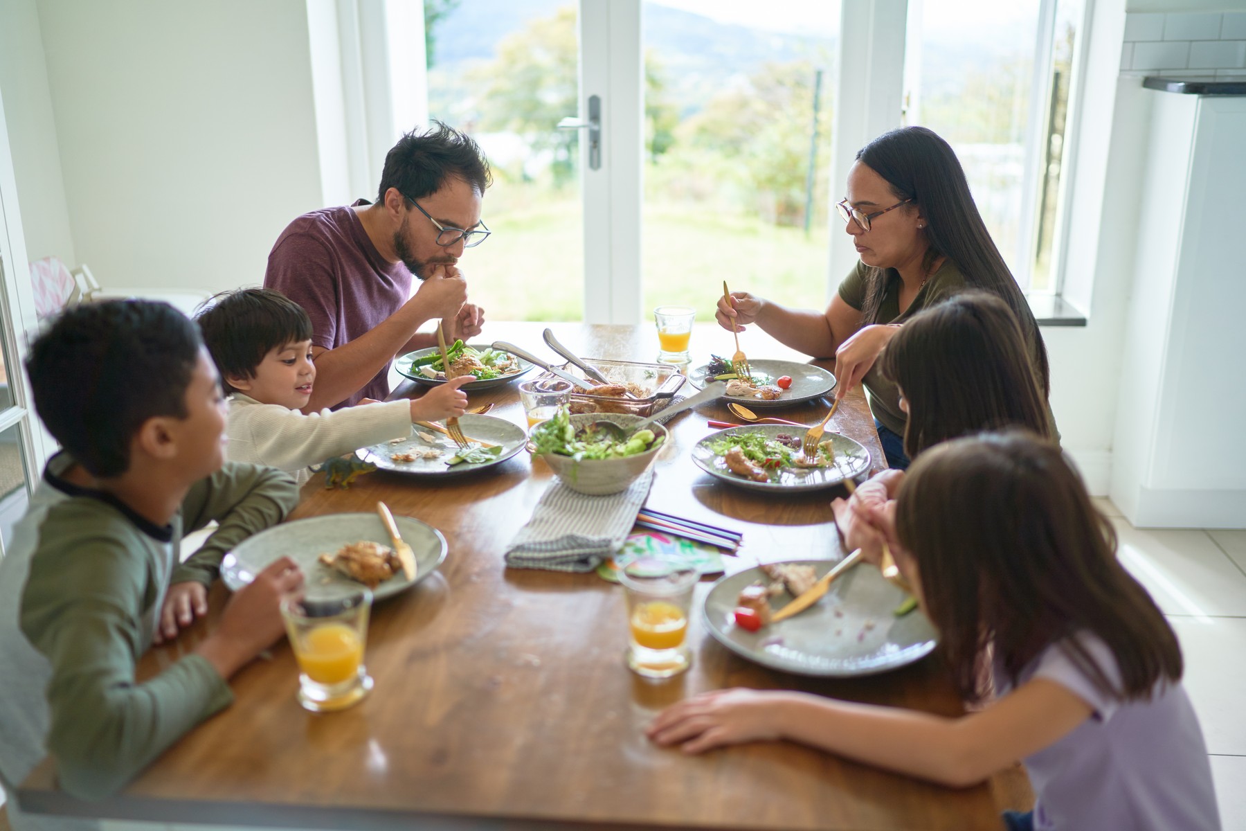 Family eating lunch at dining table