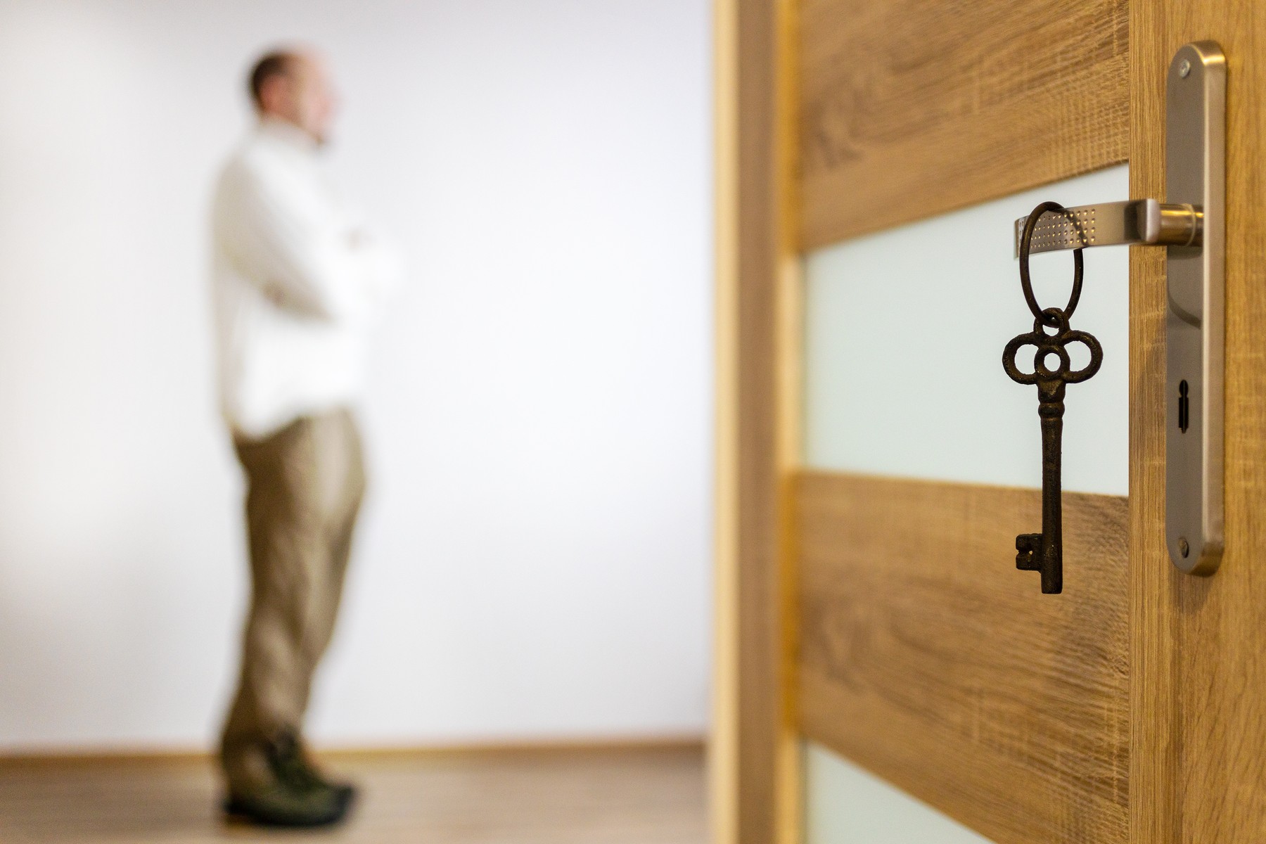 Czech economy and finance - realty estate business - buying a new house or flat - key on the door handle