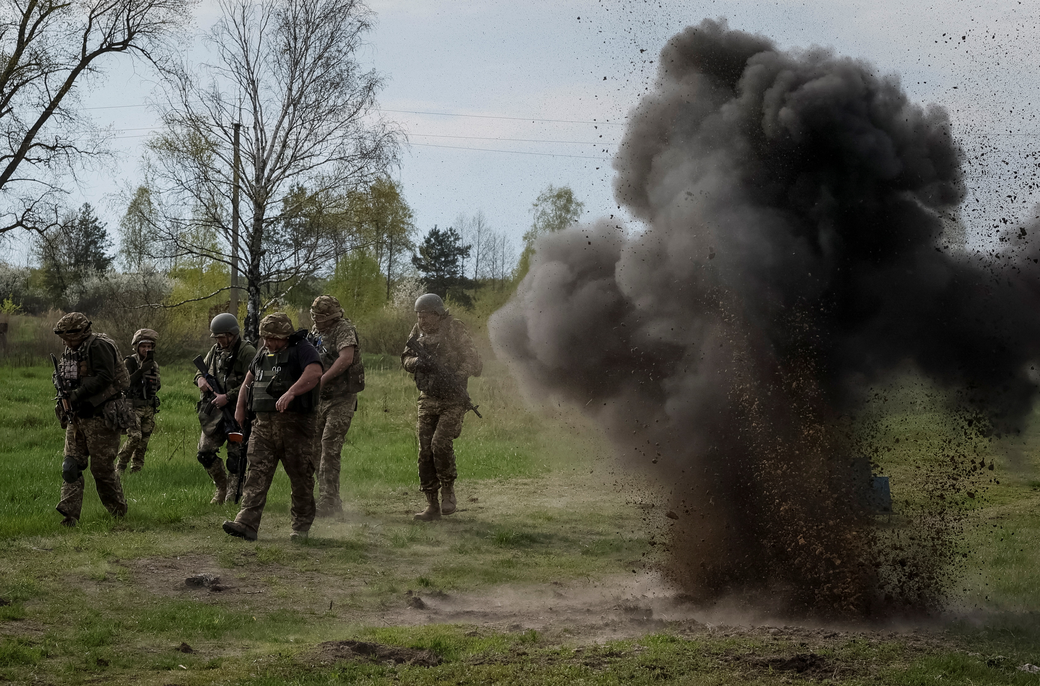 Ukrainian servicemen from the 115 Territorial Defence brigade attend an exercise near the border with Belarus in Zhytomyr region