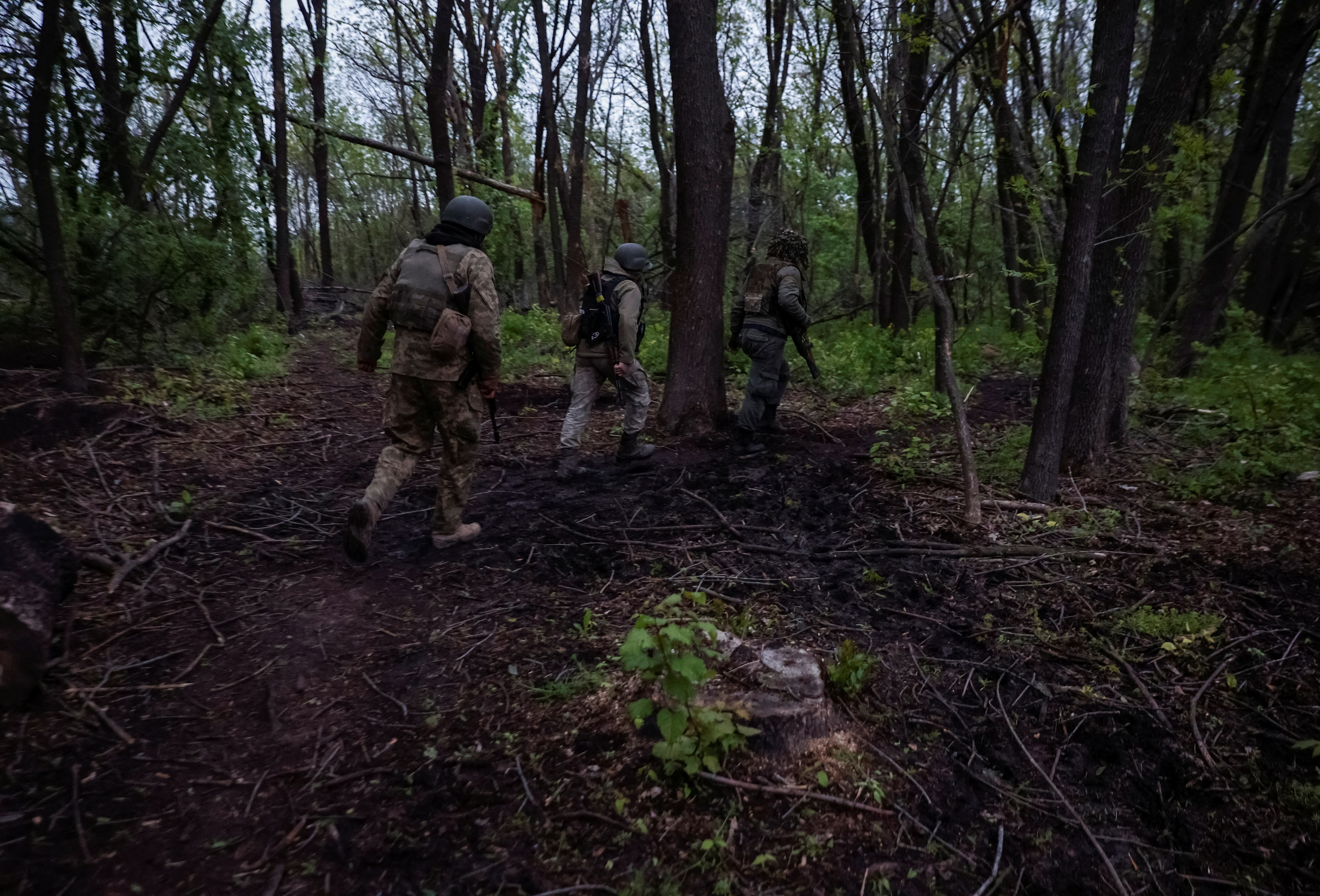 Ukrainian servicemen are seen after a fight near the front line city of Bakhmut