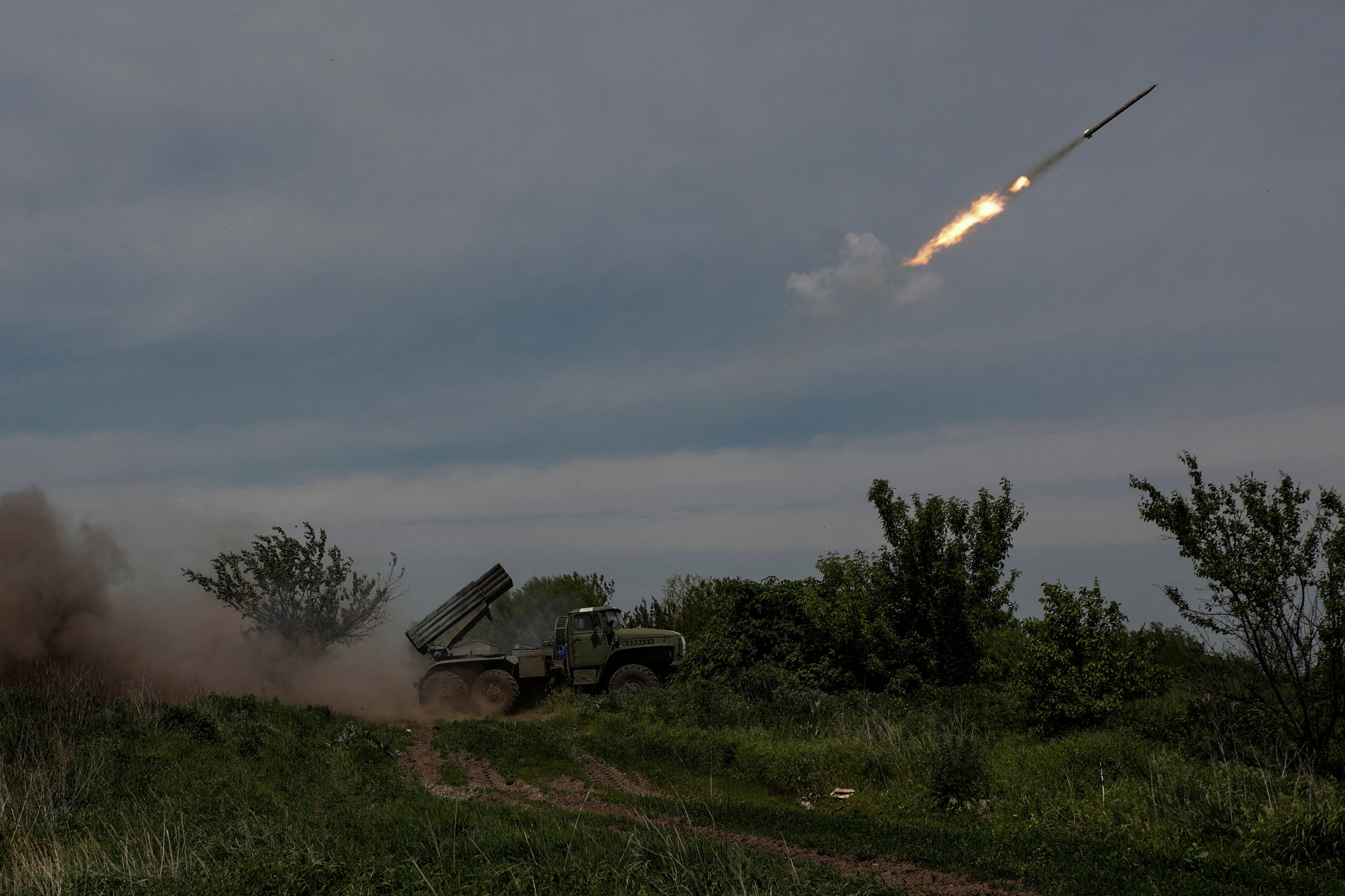 Ukrainian servicemen fire a BM-21 Grad multiple launch rocket system towards Russian troops near the frontline town of Bakhmut