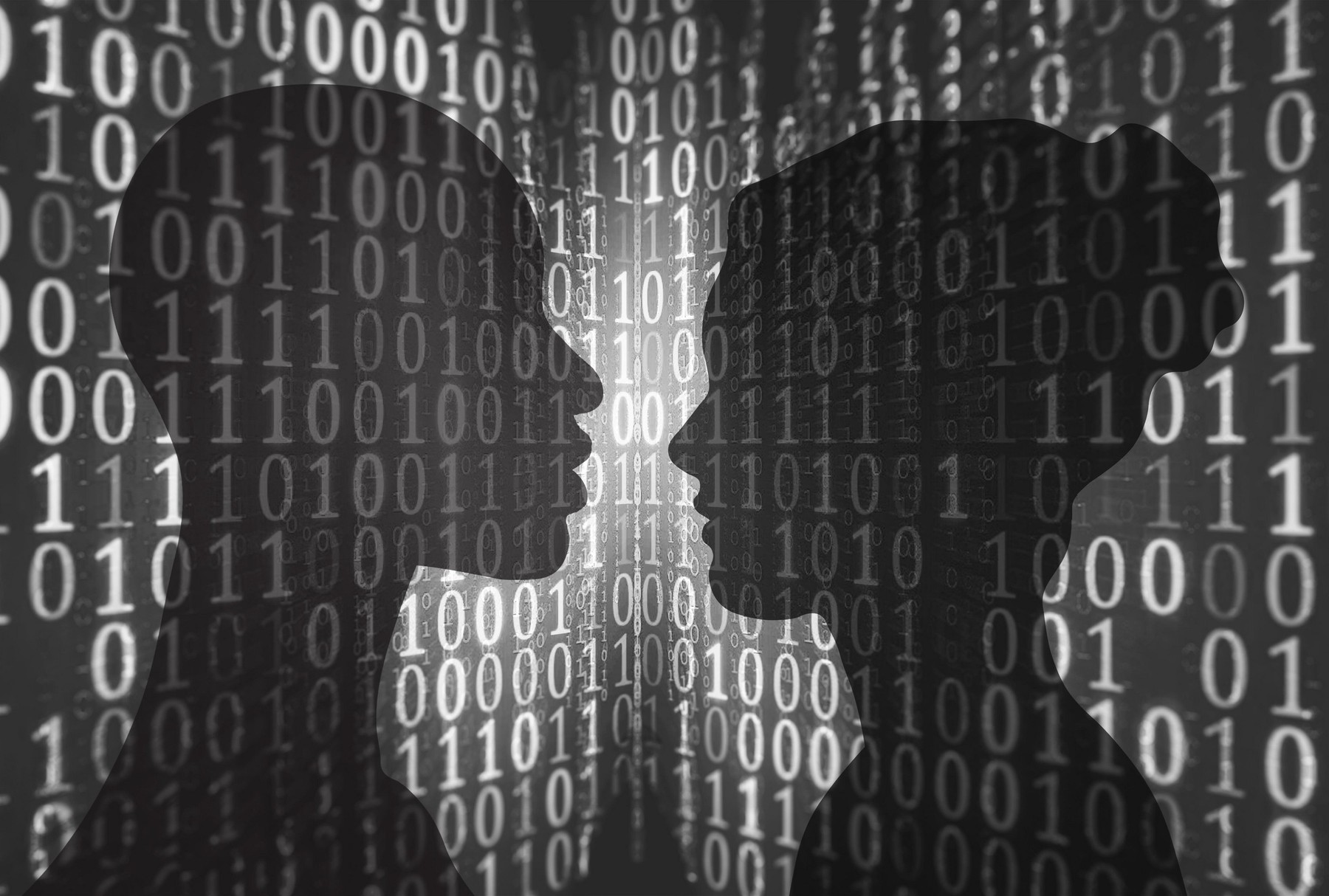 Concept image of two silhouetted heads facing each other against a binary digital background, possibly signifying online dating or cyber romance