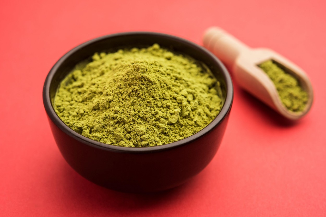Herbal henna or Mehandi powder in a bowl forming heap, Used for Tattoo or Hair Dye in India