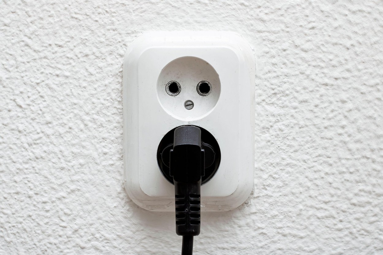 Twp sockets on a white wall close up
