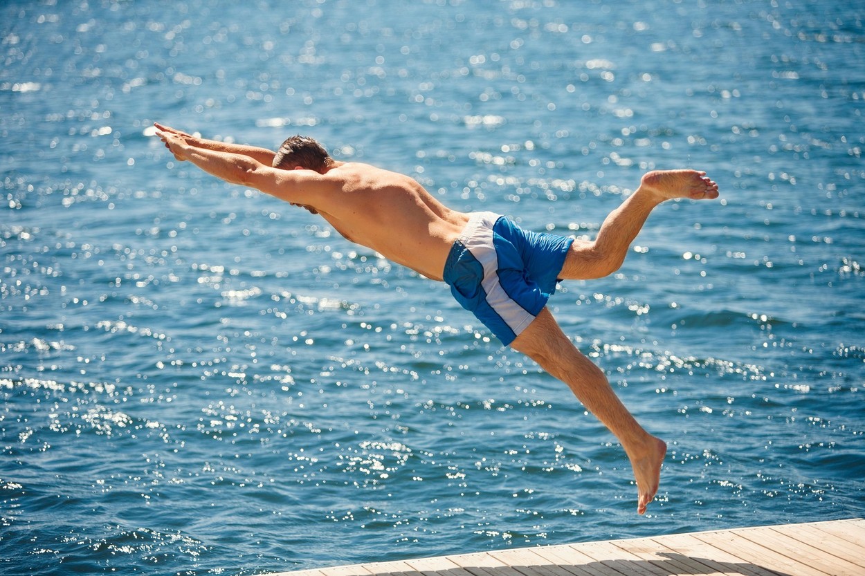 Man jumping into sea