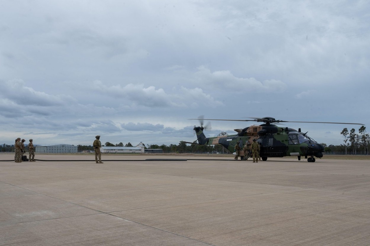 U.S. Air Force Airmen and Australian Army 6th Aviation Regiment forward arming and refueling point operators refuel an MRH-90 Taipan during Talisman Sabre 23 at Royal Australian Air Force Base Amberley, Australia, July 24, 2023. Being a multi-role machine