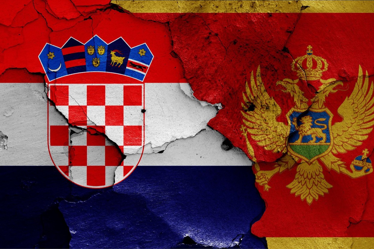 flags of Croatia and Montenegro painted on cracked wall