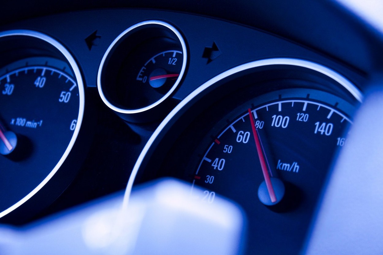 Dashboard of a car with speedometer showing 80