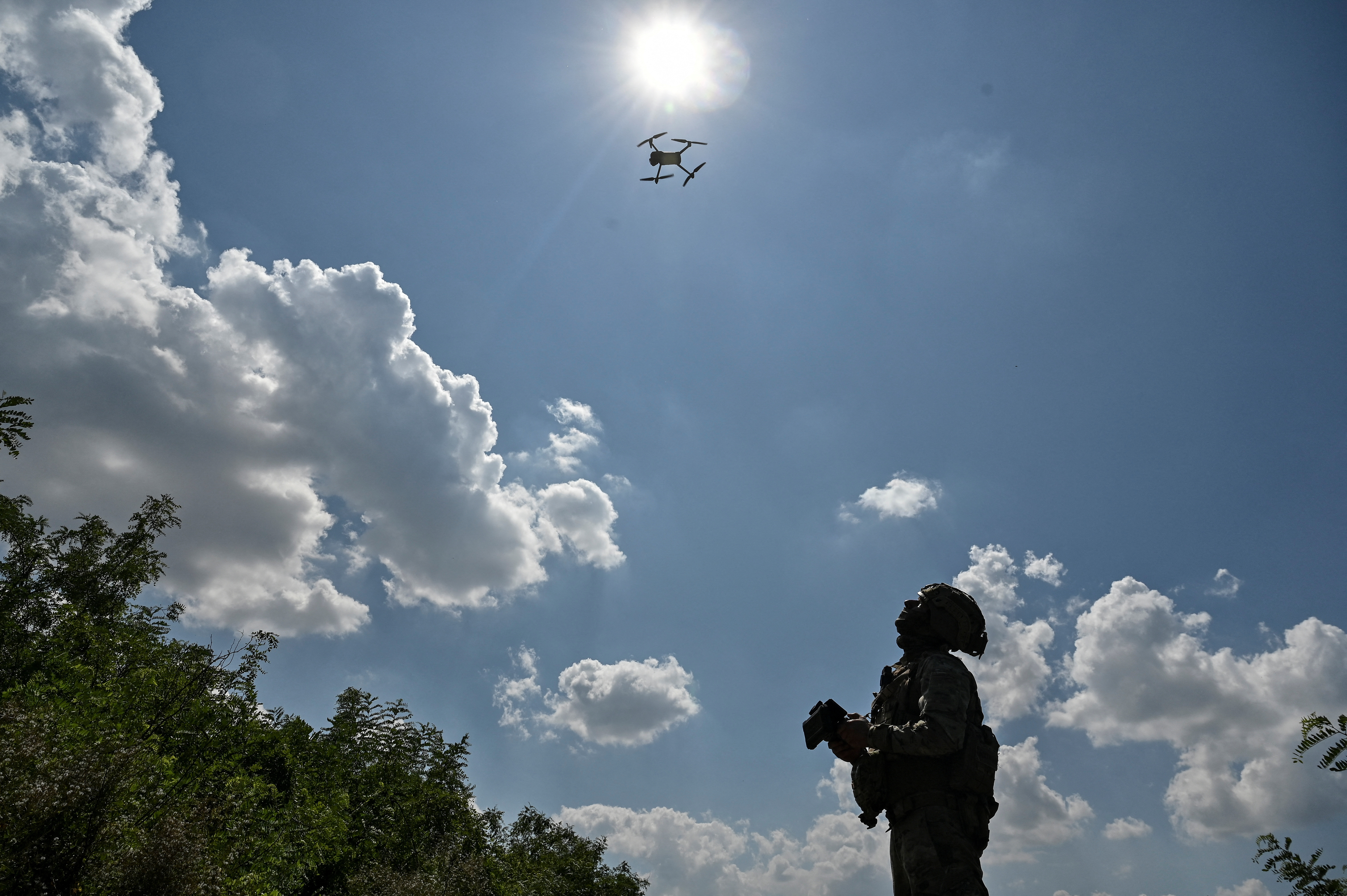 A Ukrainian serviceman launches a drone near a frontline in Zaporizhzhia region
