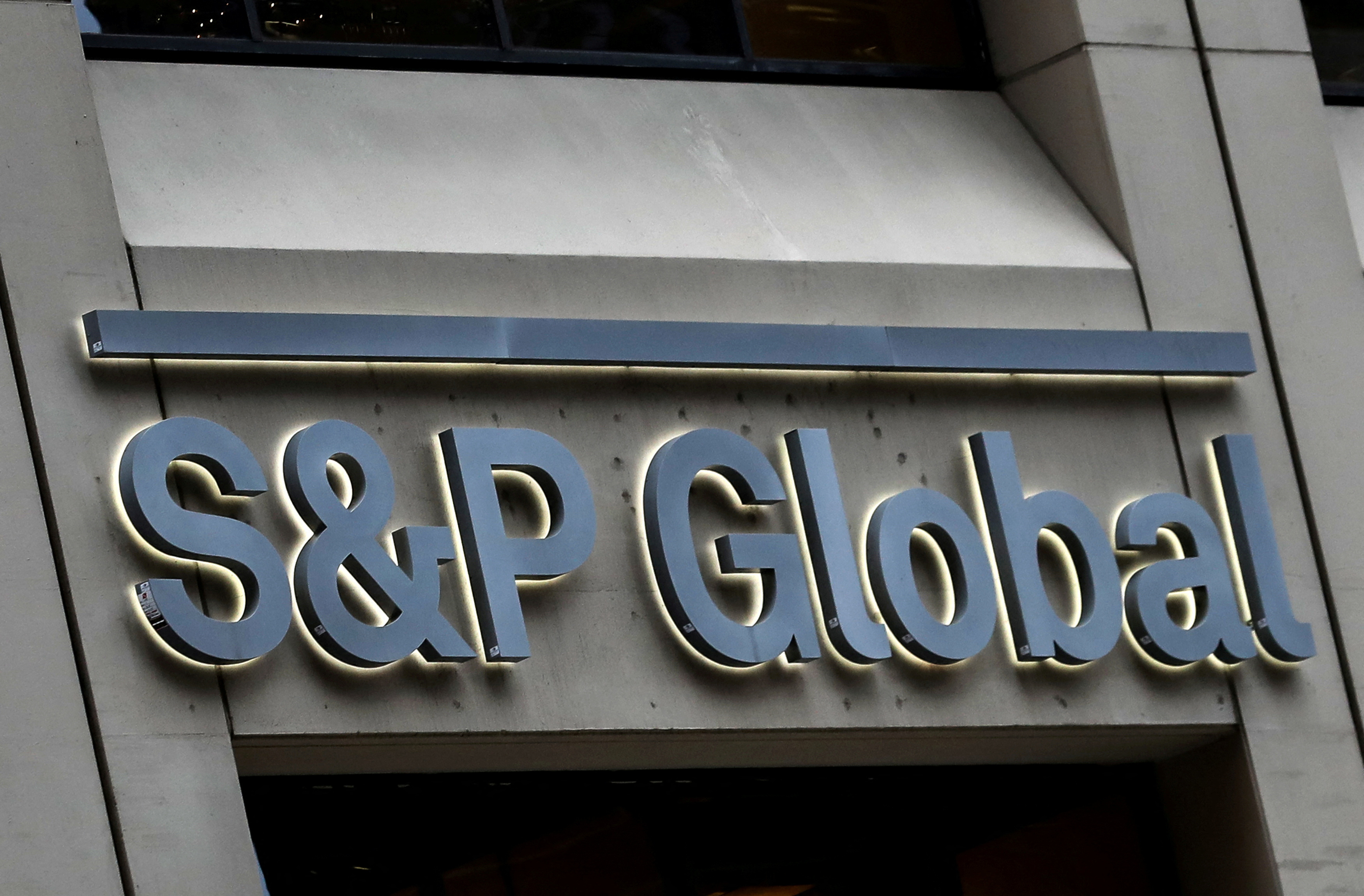 FILE PHOTO: The S&amp;P Global logo is displayed on its offices in the financial district in New York City