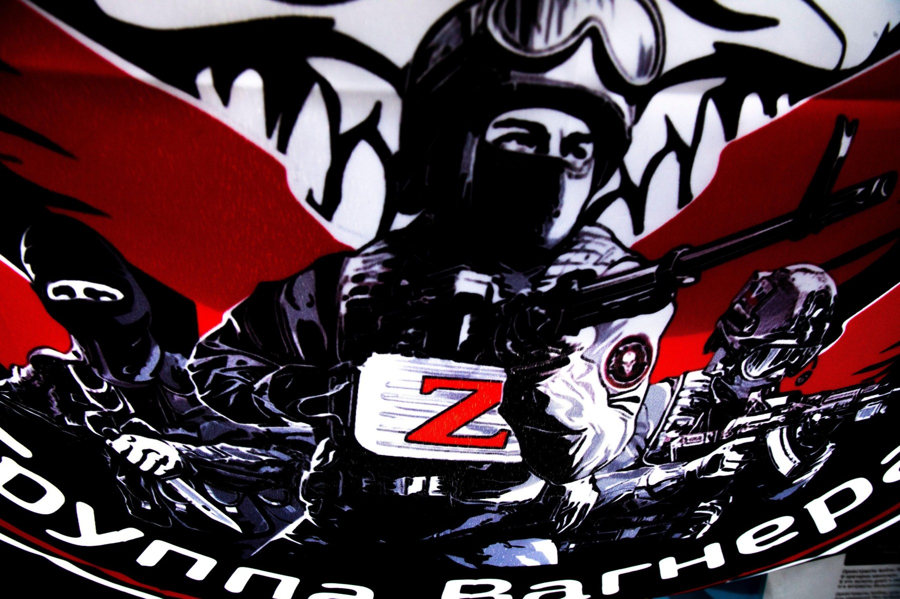 View of a flag of the Russian private military company "Wagner Group" that flutters in a wind on a street in the center of Moscow, Russia