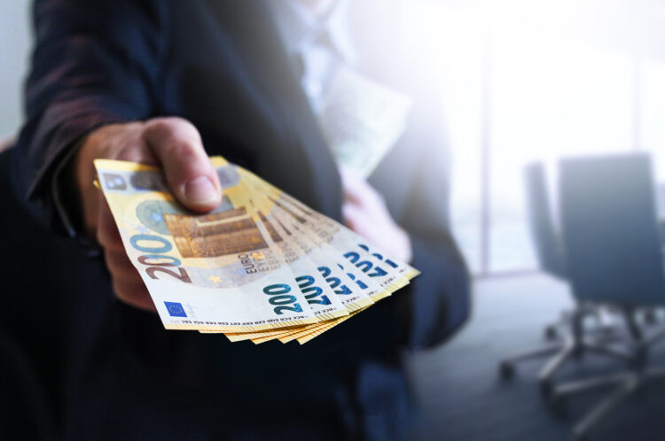Business,Man,In,Office,Holding,European,Euro,Bills.,Money,Against
