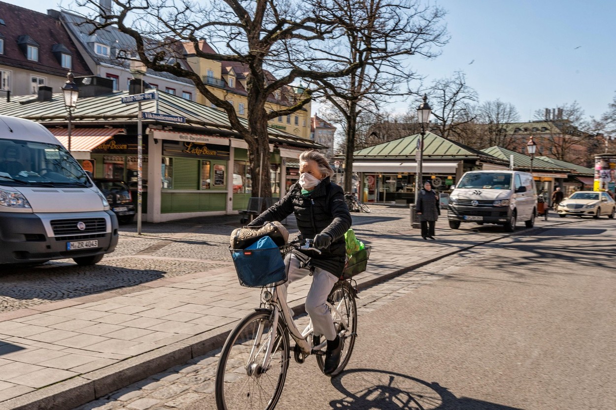 Munich - Bavaria - Germany, 31. March 2020: People wearing mouth protection because of Corona virus at Viktualienmarkt, Munich in Germany