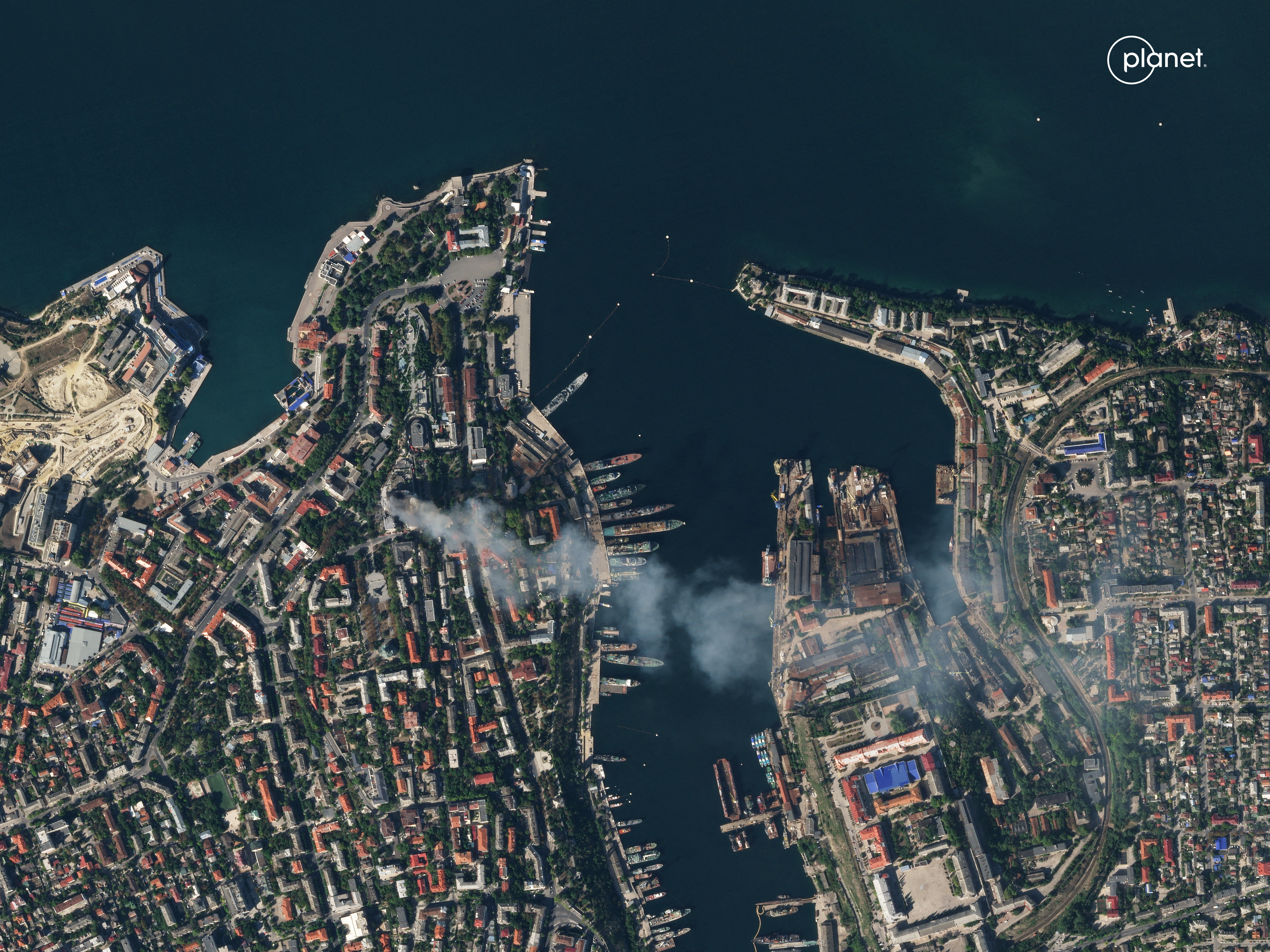 Satellite imagery shows smoke billowing from a Russian Naval HQ after Ukrainian strike