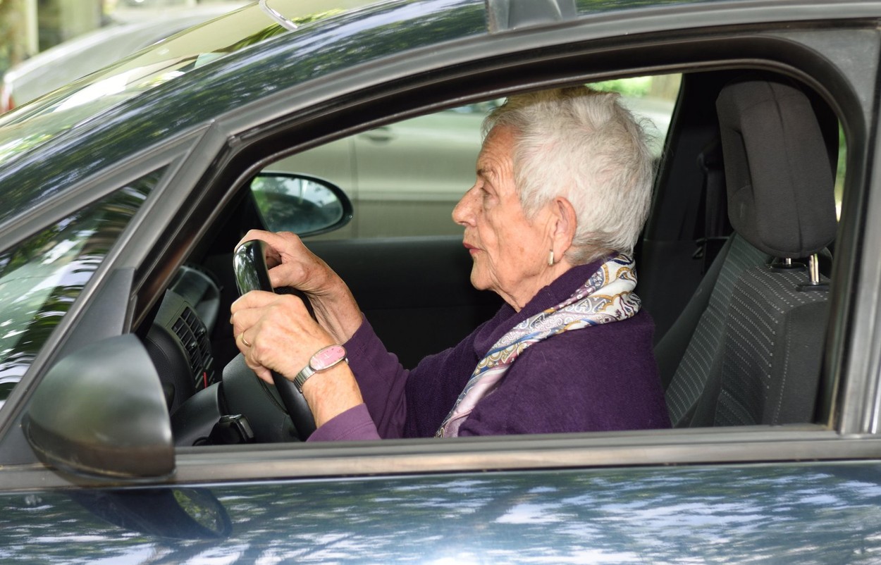 senior woman driving a car