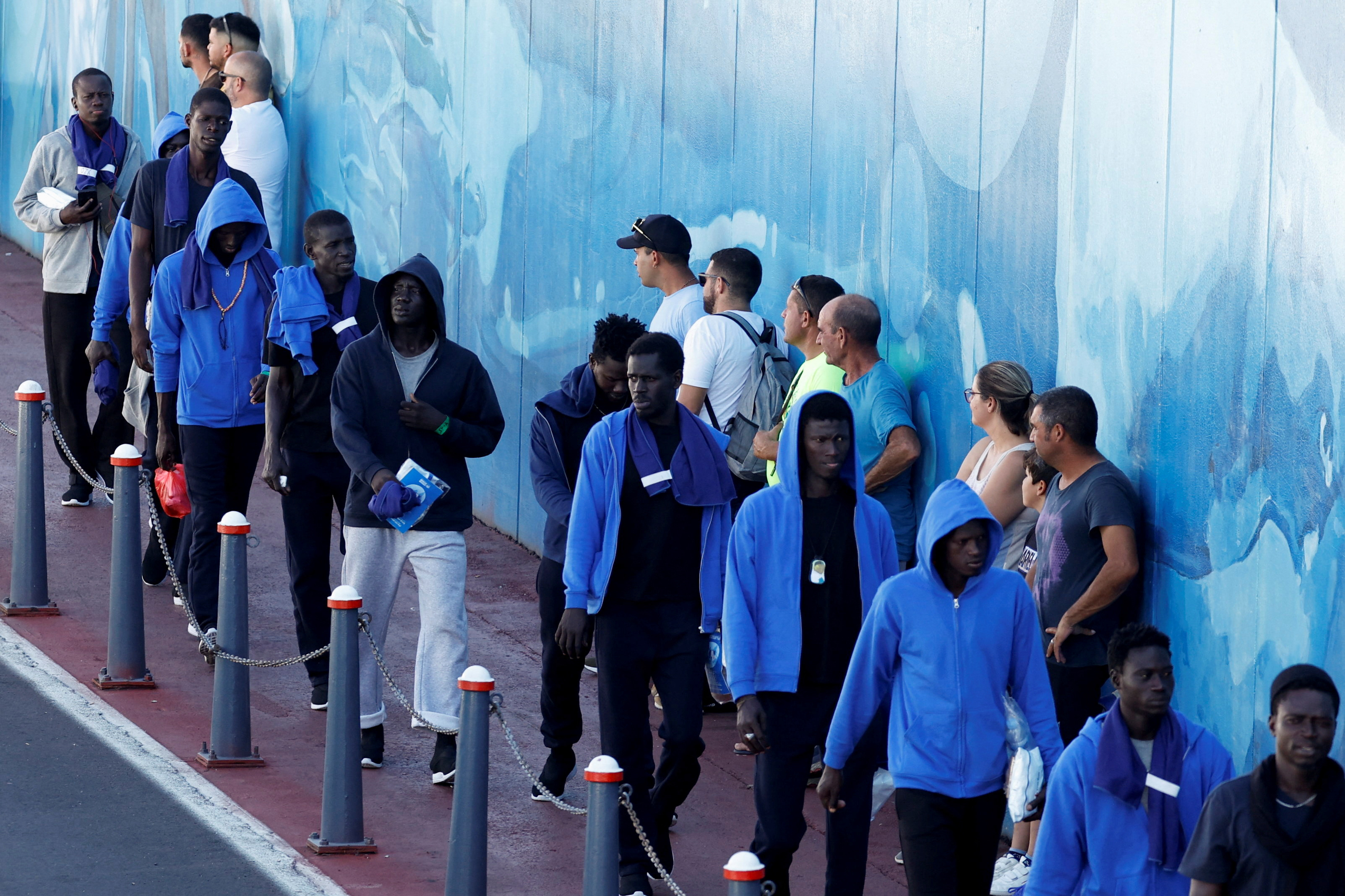 A group of migrants is transferred on a ferry to the island of Tenerife after arriving on a wooden boat to the Canary island of El Hierro