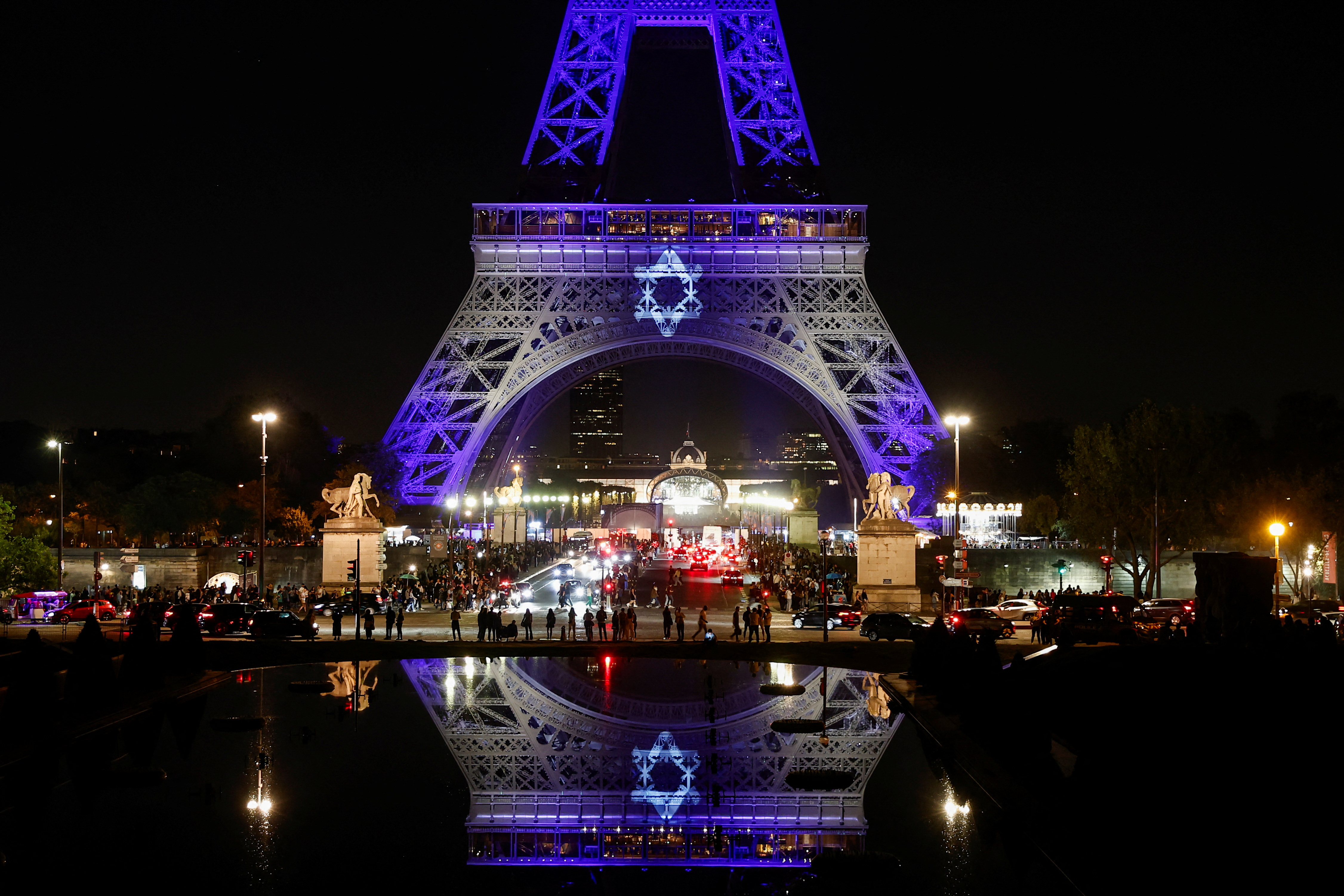 The Eiffel Tower lights up in white and blue, the colours of the Israeli flag, in Paris