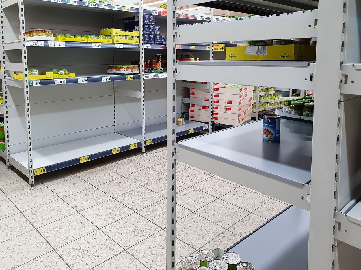 FULDA, GERMANY - MAR 14, 2020: Empty shelves for canned food at Kaufland supermarket due to Coronavirus crisis. Panic buying in quarantine leads to fo
