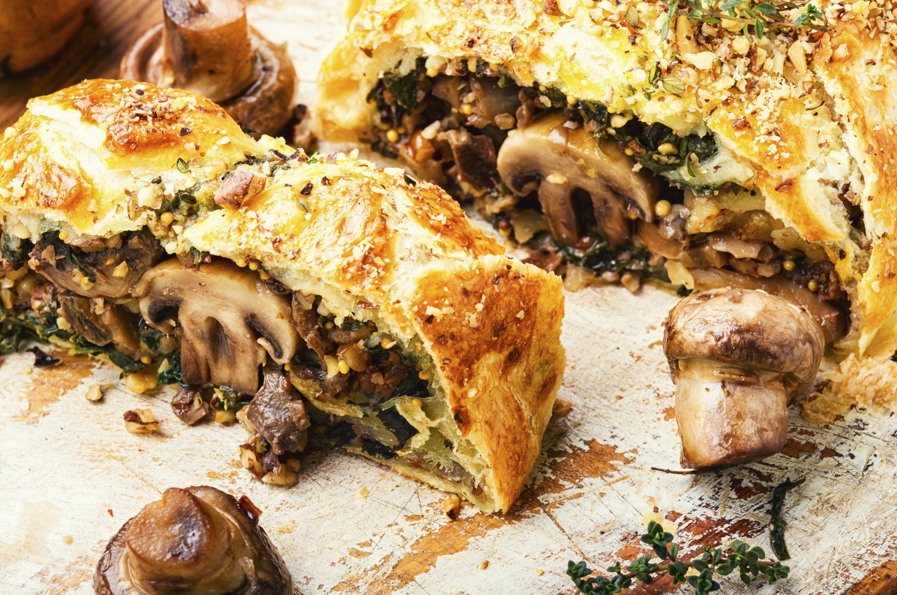 Appetizing mushroom pie or wellington mushroom. English cuisine. Sliced pie with mushrooms