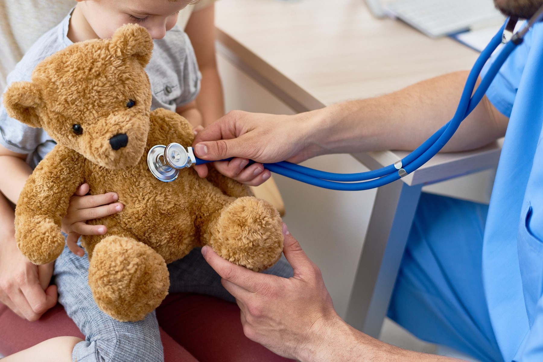 Young Pediatrician Playing with Little Patient