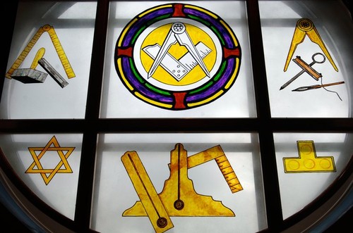 Close up of a plate glass window showing masonic symbols in a Freemasons Lodge