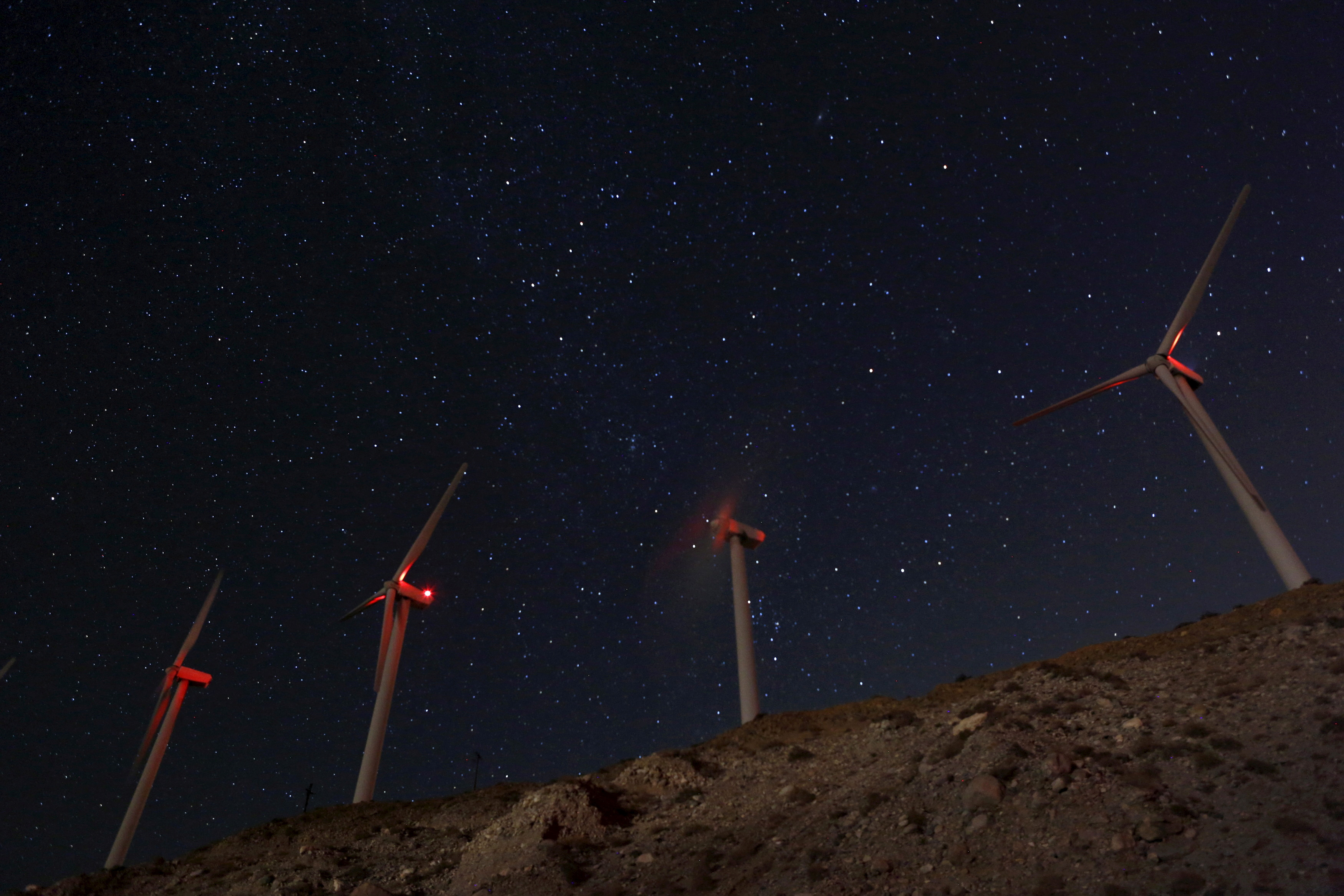 FILE PHOTO: Windmills at the San Gregornio Pass Wind Farm near Whitewater, California are shown in this evening time exposure