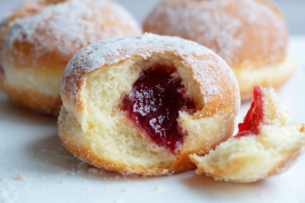 Fresh,Baked,And,Garnished,With,Powdered,Sugar,German,Doughnuts,-