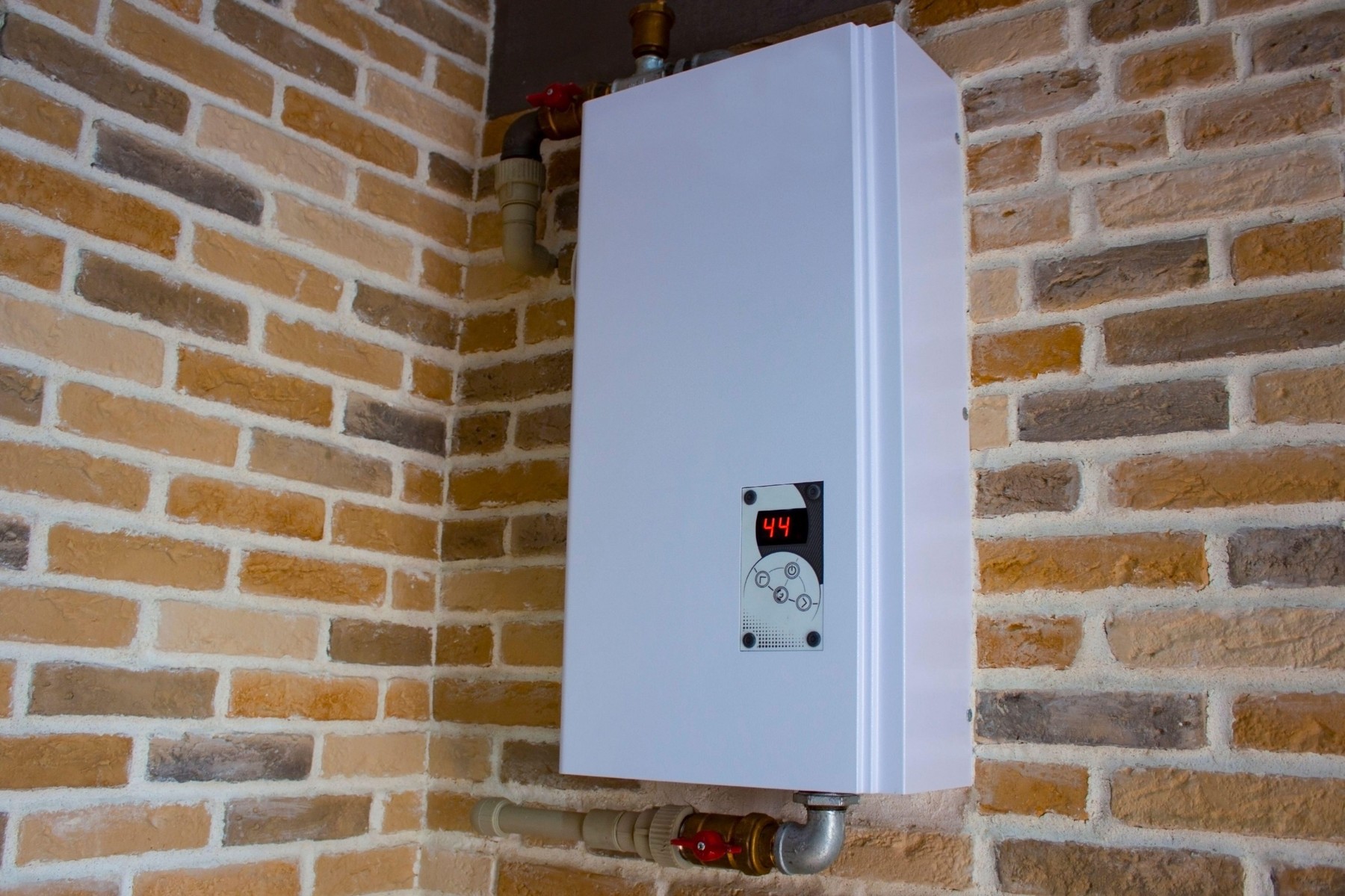 Water heating system with temperature control. Electric boiler with water inlet and outlet. The boiler for heating water is used in a residential buil