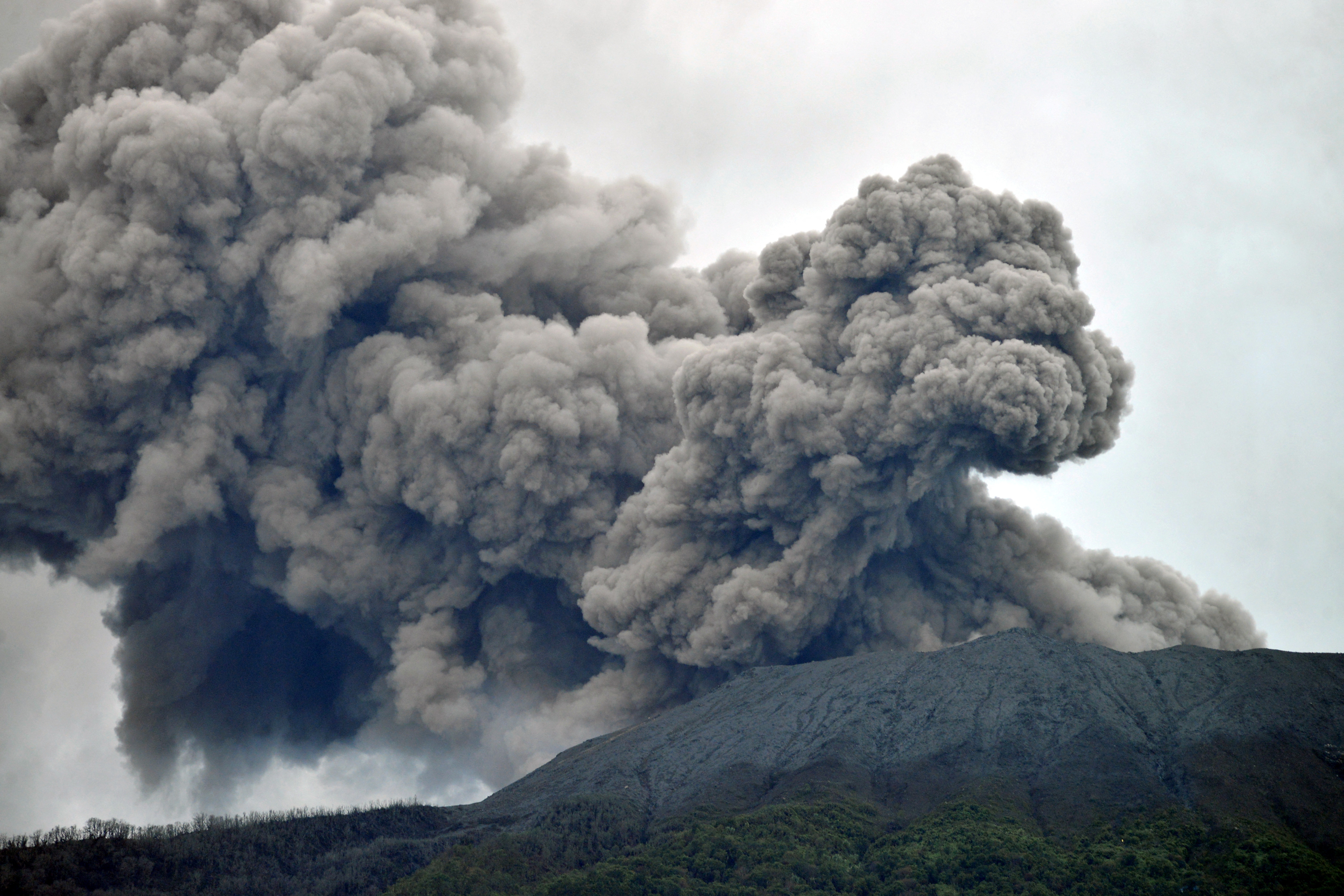 VULKAN, MARAPI, SUMATRA, Mount Marapi volcano spews volcanic ash as seen from Nagari Batu Palano in Agam