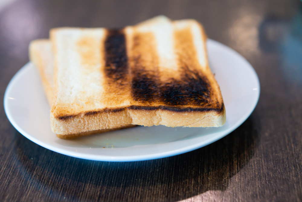 Slices,Toast,Bread,Isolated,On,White,Dish,And,Coffee,Cup