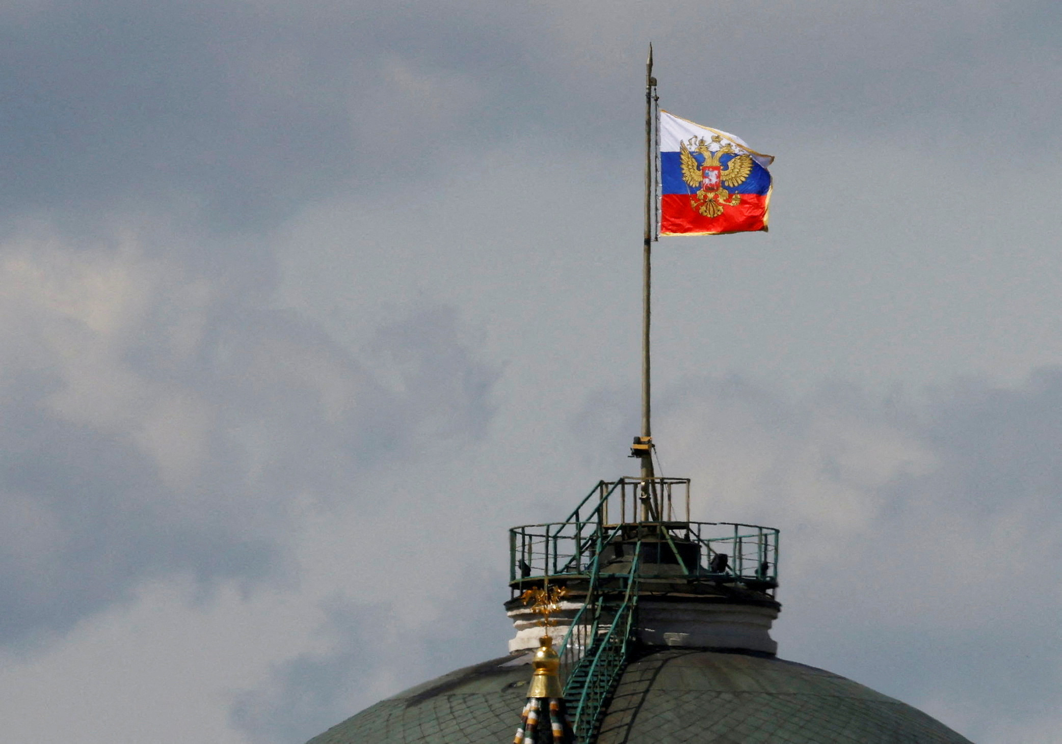 FILE PHOTO: The Russian flag flies on the dome of the Kremlin Senate building in Moscow