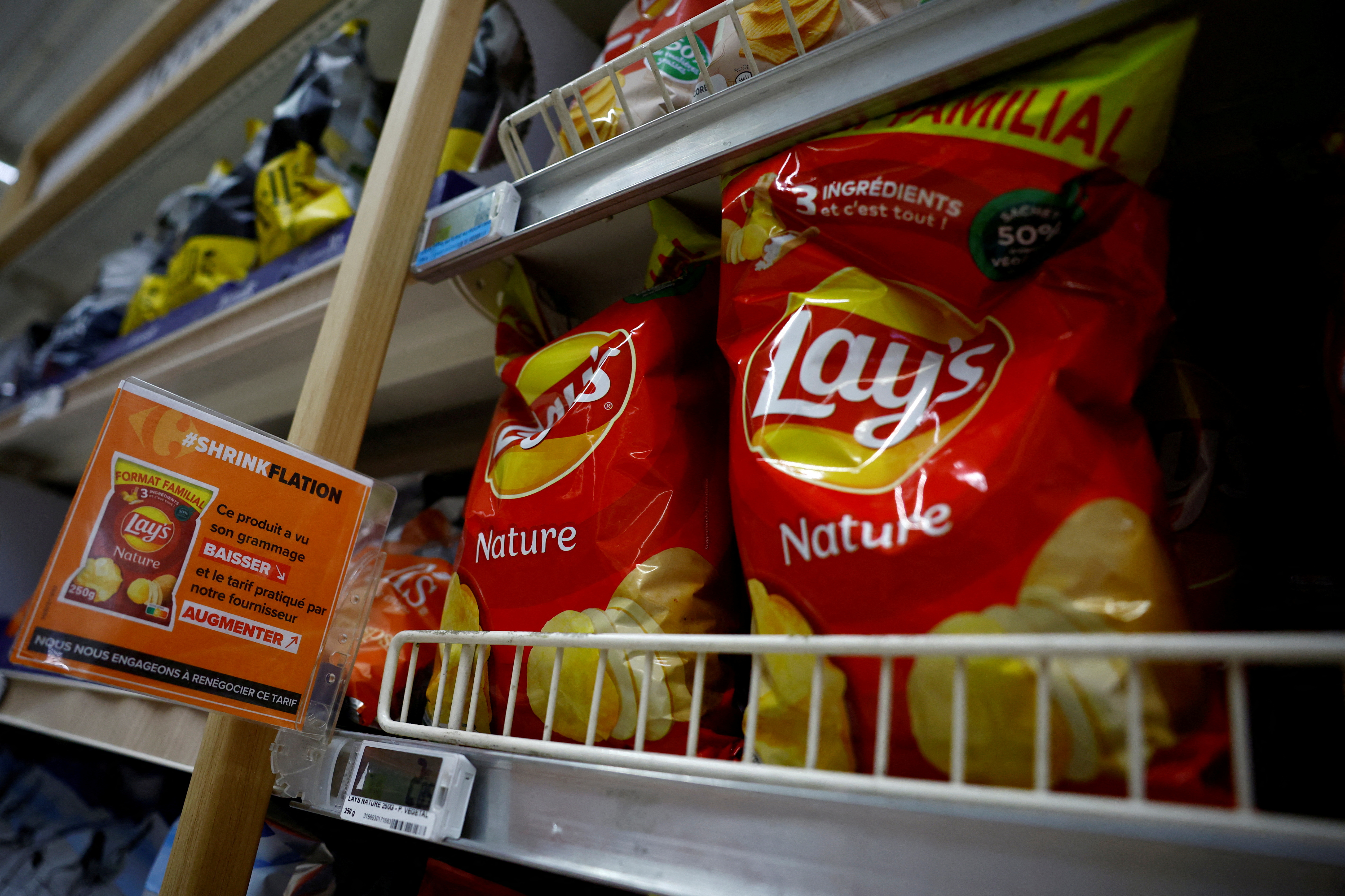 FILE PHOTO: Customers shop in a supermarket near Paris