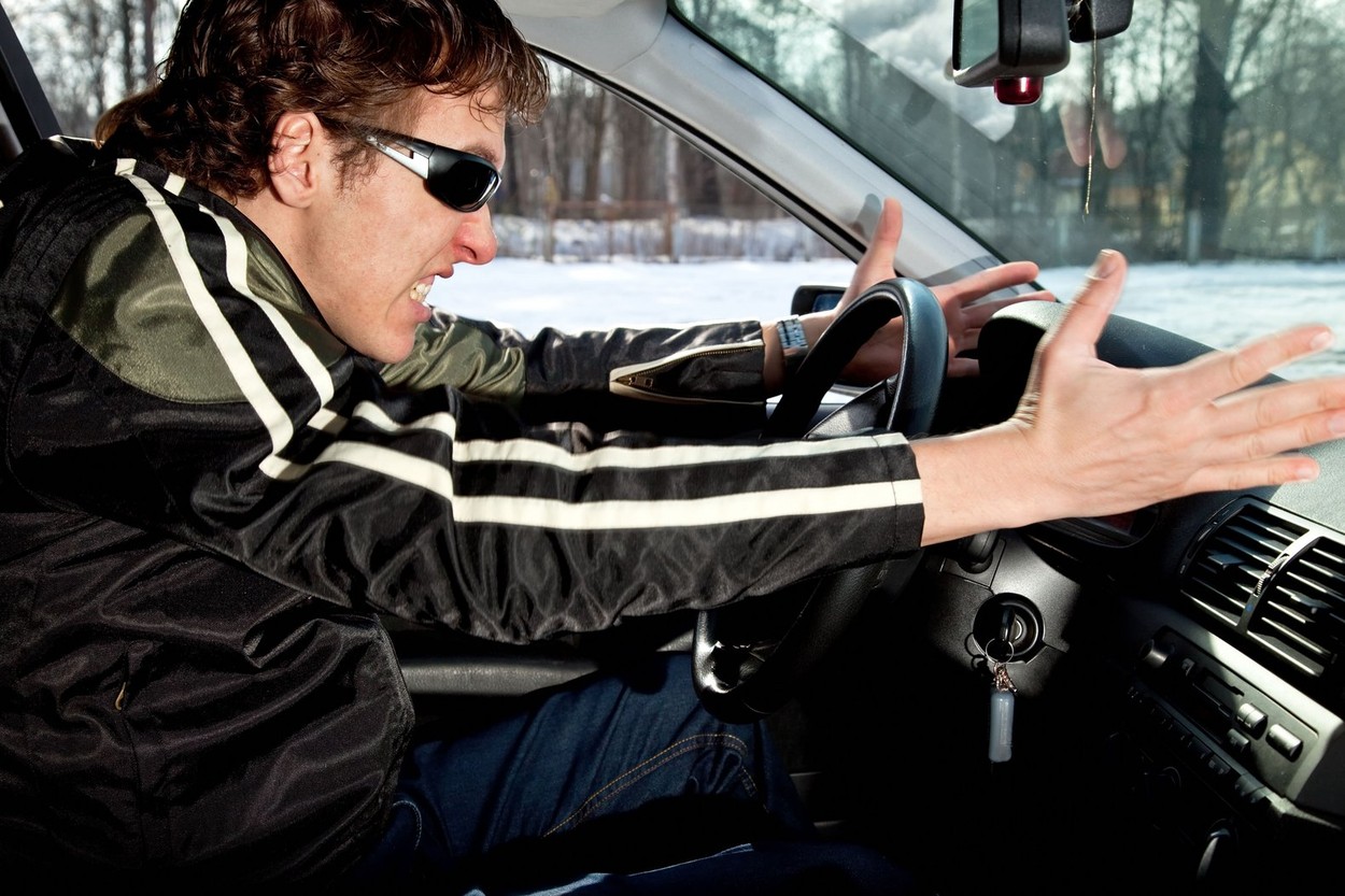 Aggressive driver driving a car and swearing