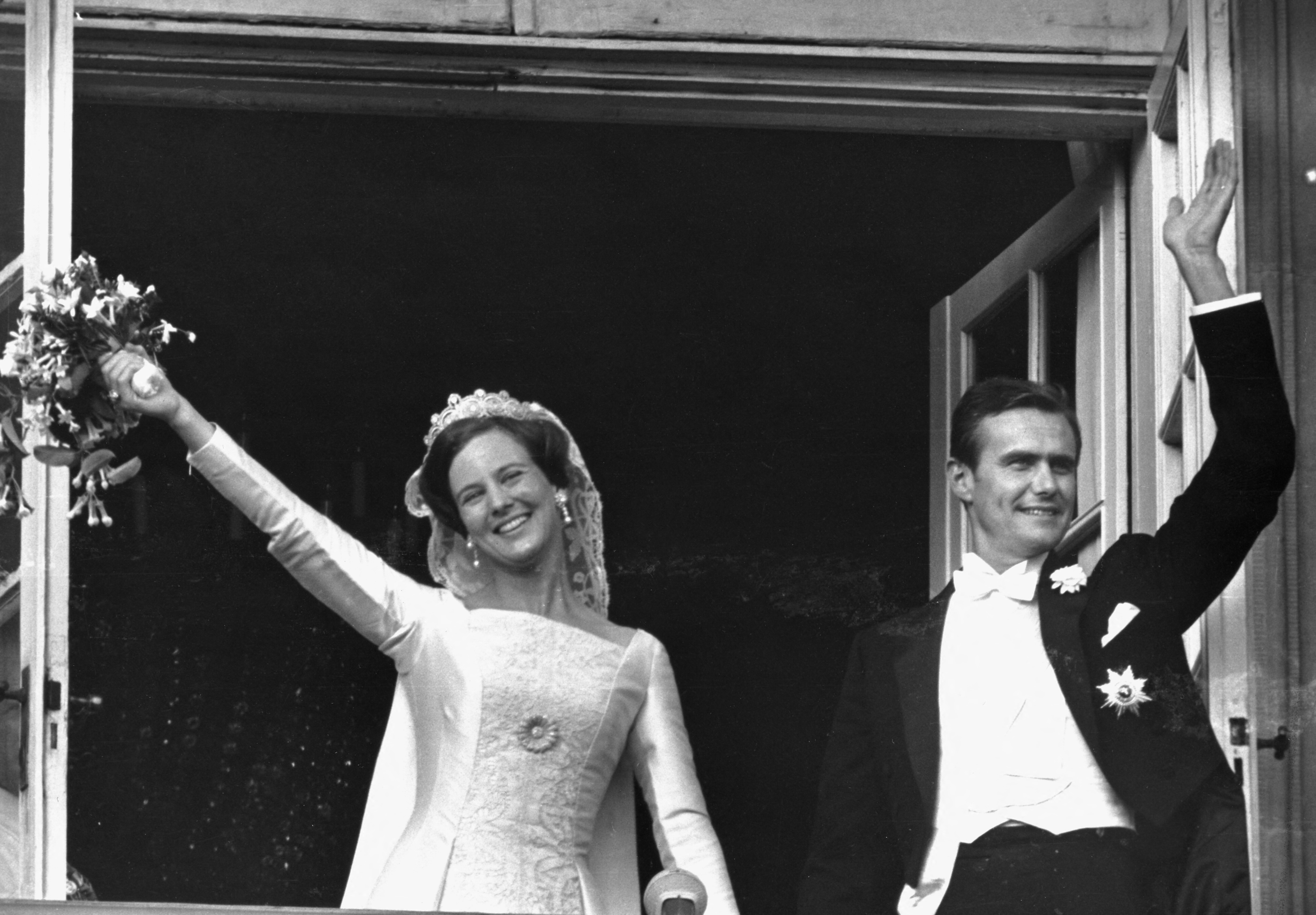 Denmark's then-Princess Margrethe and Henri de Monpezat gesture at their wedding at Amalienborg Castle, in Copenhagen in 1967