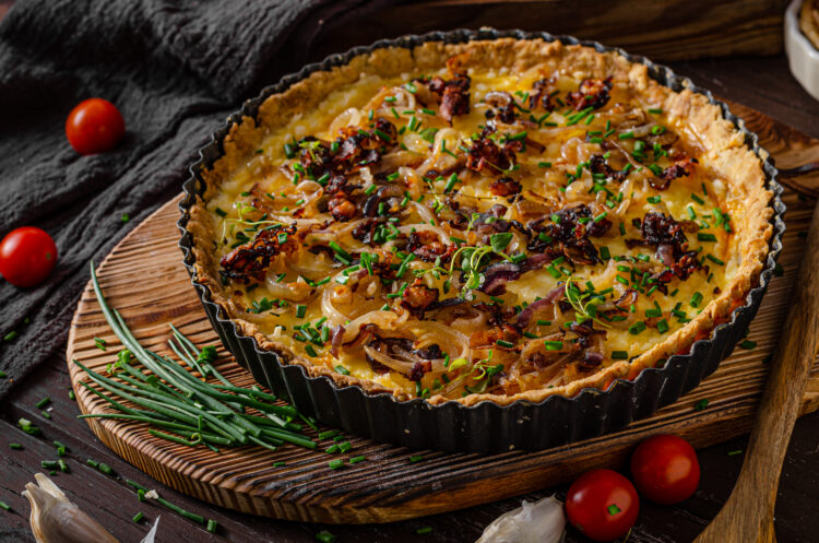 Homemade cheese quiche with onion and bacon