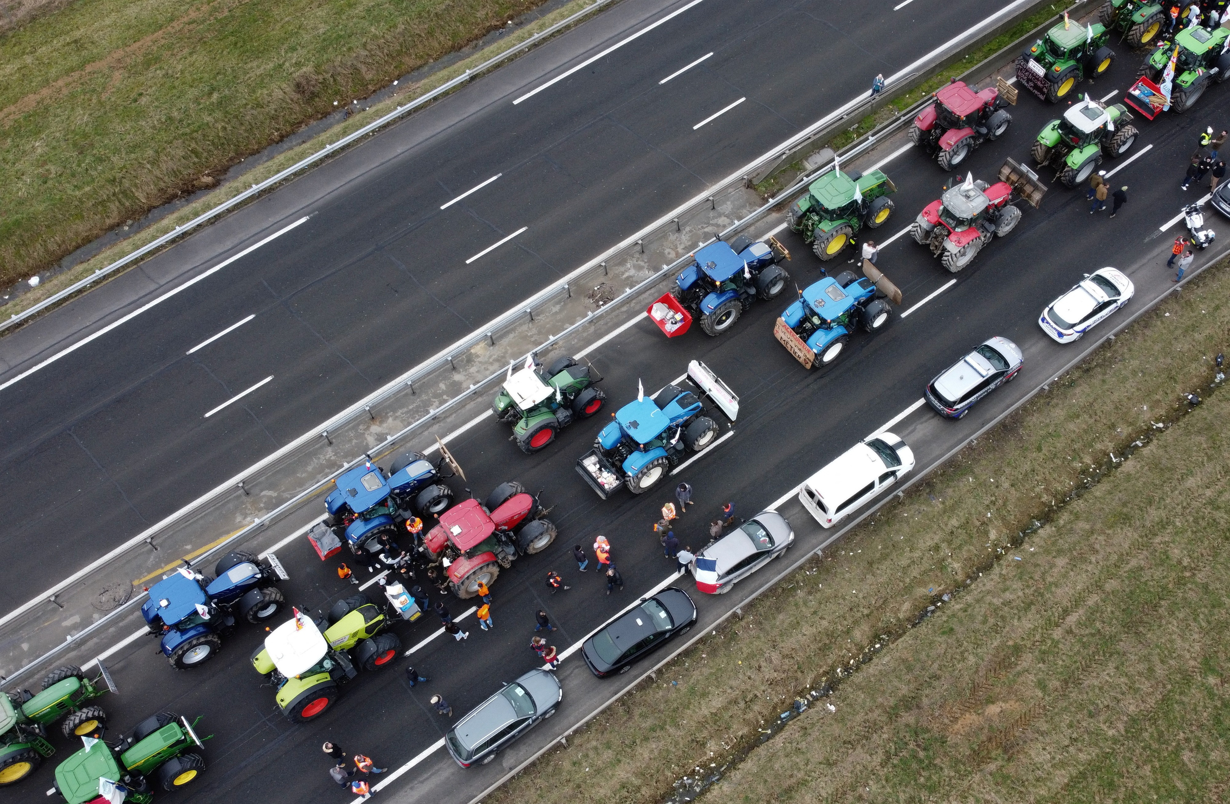 Tractors are lined up during a blockade by farmers on the A4 highway in Jossigny, near Paris