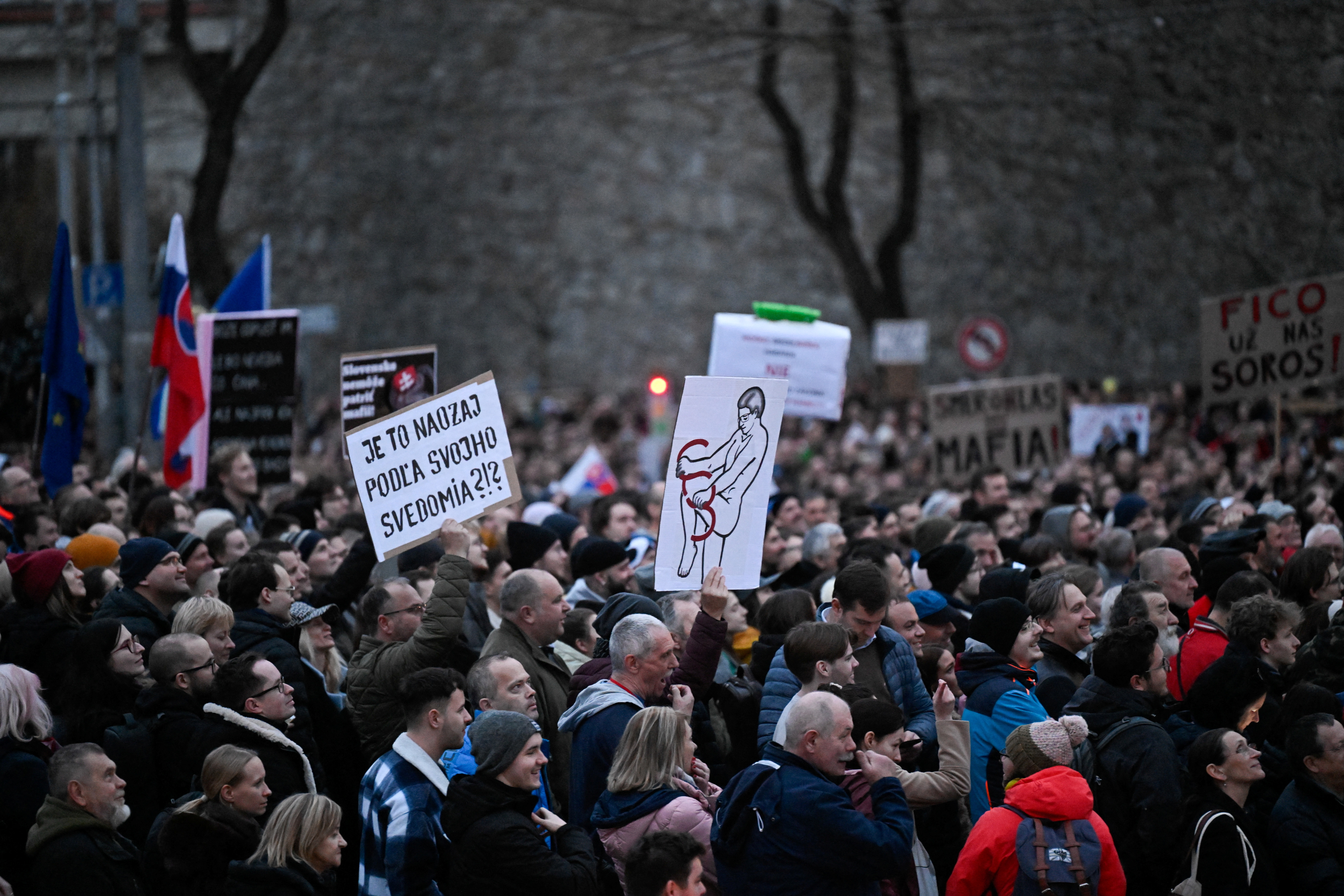 Demonstrators attend a protest against the government's proposal to cancel a branch of prosecution, in Bratislava