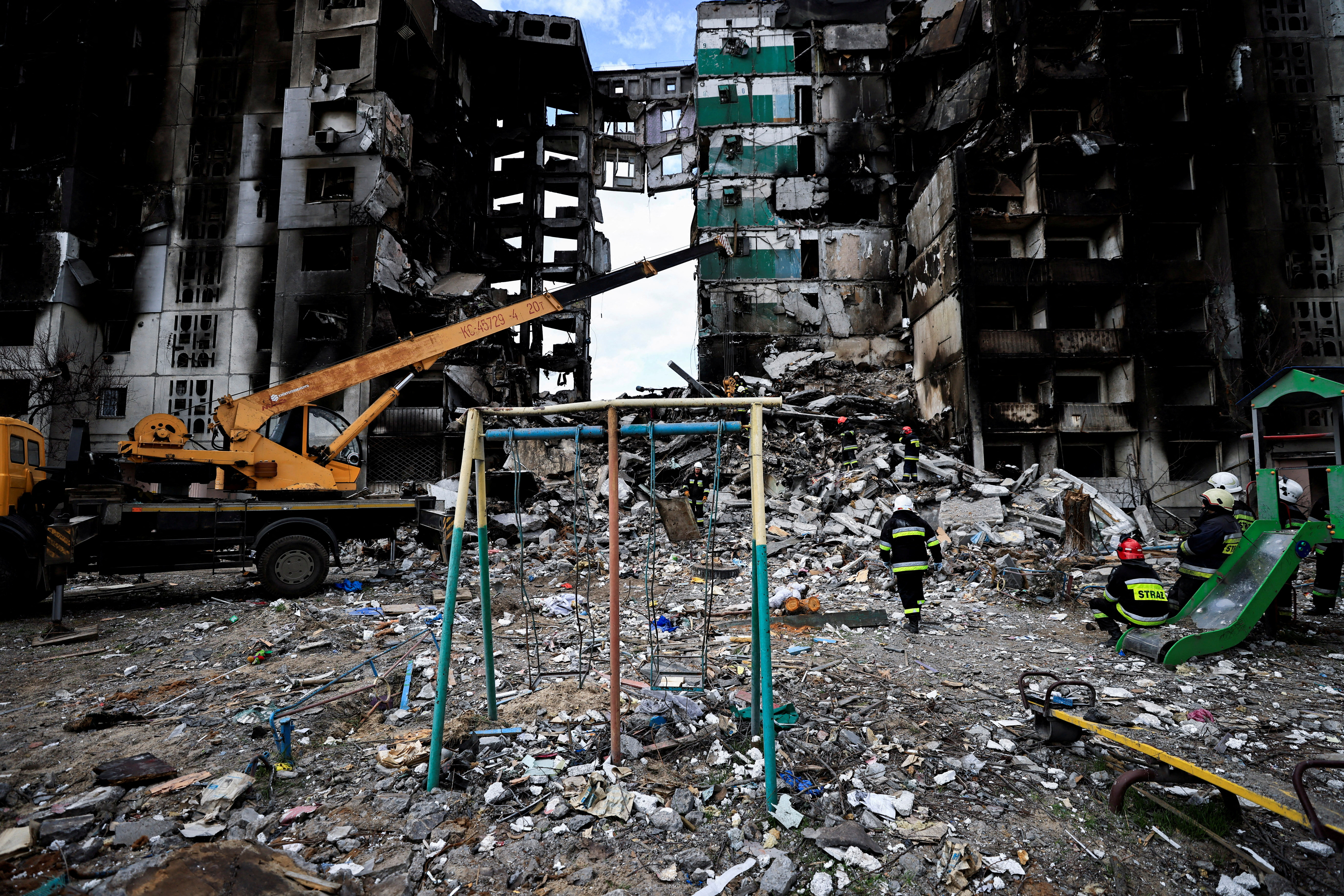 FILE PHOTO: A rescuer walks during a search operation for bodies under the rubble of a building destroyed by Russian shelling, amid Russia's Invasion of Ukraine, in Borodyanka